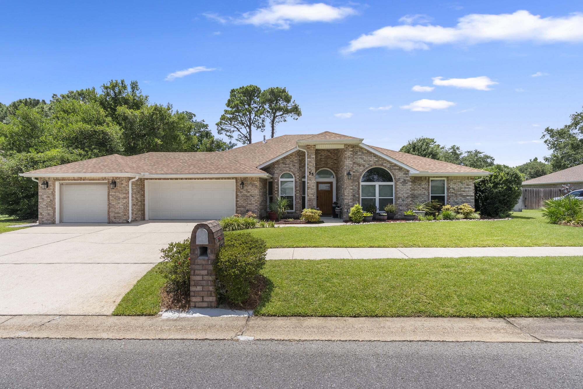 Custom 4BR/3BA + office in Shalimar with a smart split floor plan! Two bedrooms share a Jack-and-Jill bath, one guest room is near a full bath, and the private primary suite is on the opposite wing. The office features built-in shelving, filing cabinets, and a hidden shredder/trash drawer. Interior highlights include travertine tile, gas fireplace, automated lighting, and extensive storage throughout. The 3-car garage offers a separate 1-car bay set up as a workshop with drive-through access to the backyard. Outside: a large enclosed heated pool, mature blueberry bushes, privacy-fenced yard, and a shed. A full-home generator adds peace of mind. Located just 3 mi to Eglin's east gate, 10 mi to Hurlburt Field and the beach!