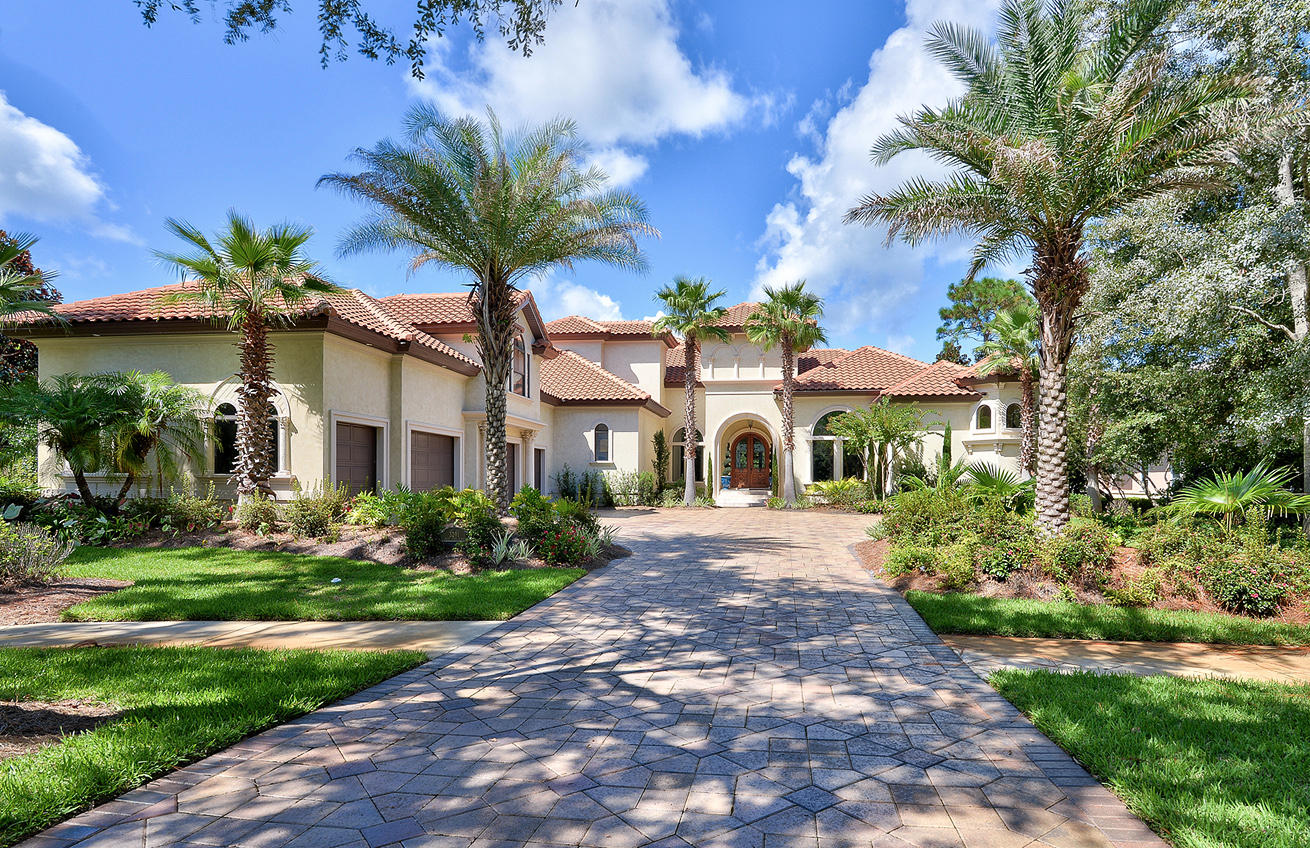 One of the most beautiful homes you will find in Burnt Pine - situated perfectly on a large lot on Burnt Pine Lane, offering gorgeous views across the lake to the 10th and 11th fairways. This 5 bedroom, 5 1/2 bath plus office is graceful and balanced with just the right amount of flair. Offering approx 6,200 square feet of indoor living area with expansive outdoor living - perfect for large family gatherings or entertaining. All the features and finishes you would expect ion in the finest of homes ---large chef's kitchen, 1st floor master suite with sitting area and fireplace, elegant home office, four beautifully designed guest suites (one on the first floor), elevator, expansive outdoor living and gorgeous views throughout. Again, one of the finest offerings in Burnt Pine.