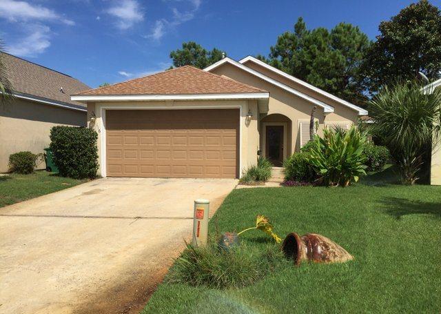 REO ~ This 3 Bd / 2 Ba home offers an open floor plan with vaulted ceilings in the living room as well as tile flooring. The master bedroom features laminate wood flooring & the master bath features double vanity. The rear of the home features pavered patio perfect for entertaining. Emerald Heights is a great location in Destin close to shopping, dining & the beach!