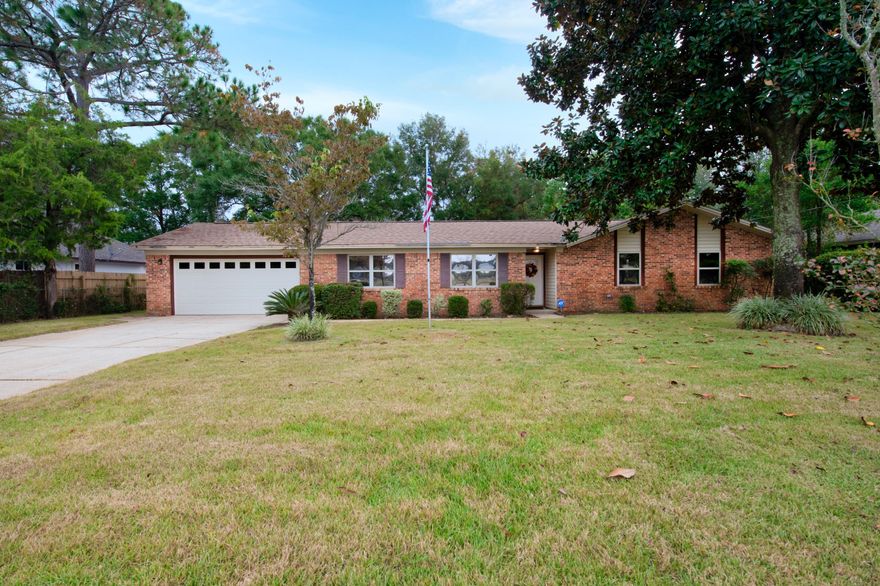 Welcome Home.  This brick home  has been freshly painted, has new carpet and is ready for new owners.  The home features  two living areas and an open kitchen dining area.  The kitchen has stainless appliances and solid surface counter tops.  The master bedroom has a unique/hidden walk in closet.  The garage has been converted to a work shop and a air conditioned bonus room which could be used as a man cave, she shed or music room.  The screen enclosure overlooks the large  in ground pool which is perfect for entertaining or just relaxing.  The chlorinator was recently replaced.  The roof was replaced in 2014 and the a/c was replaced in 2015.  The home is centrally located between Eglin AFB (7.8 miles away) and Hurlburt Field (5.4 miles away) and is located near ball fields, eateries,