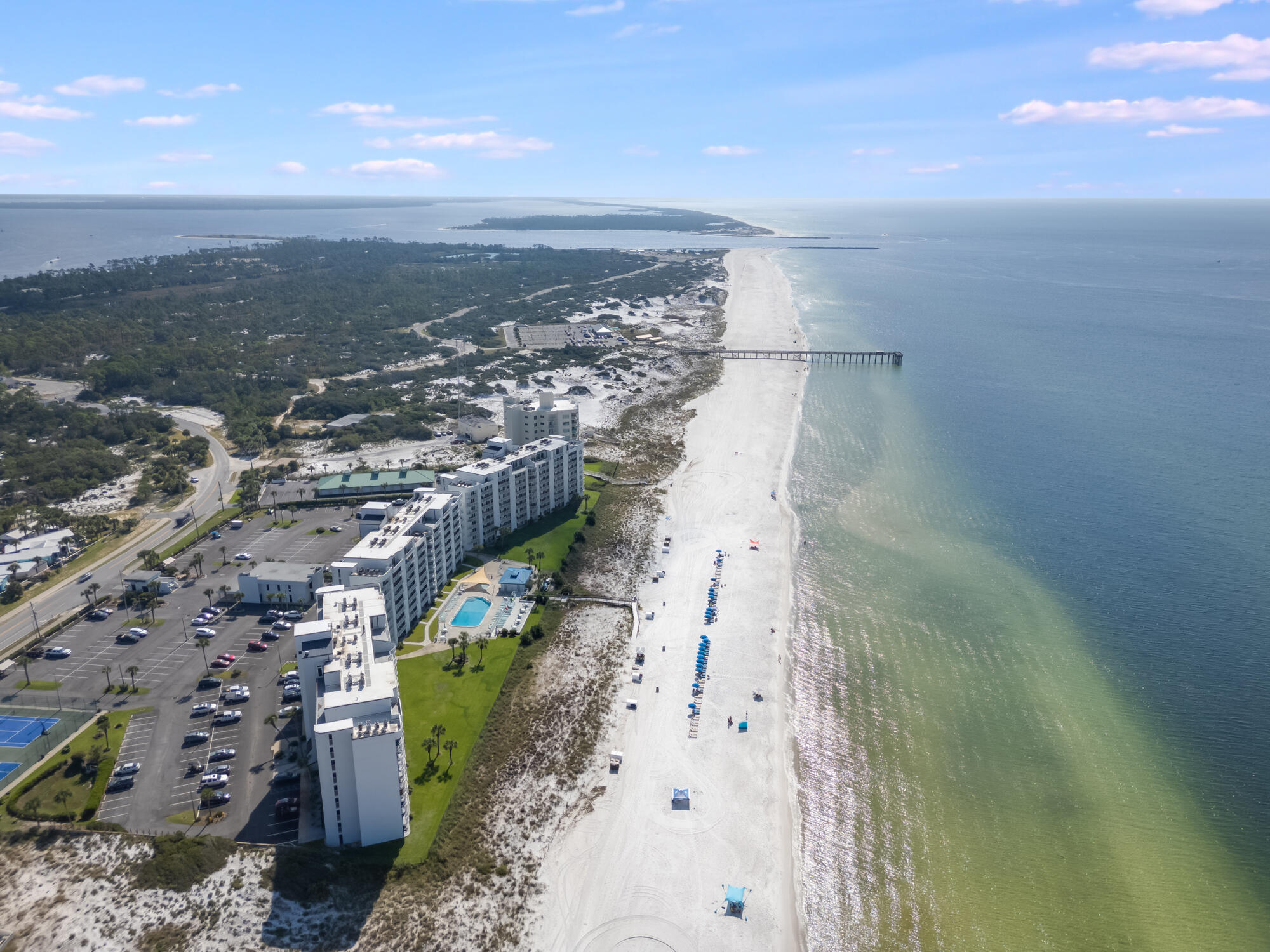 Experience beachfront luxury at Moonspinner Condominiums on the tranquil east end of Panama City Beach. This unit, originally a 3-bedroom, 3-bath, has been thoughtfully remodeled to a 2-bedroom with a bunk room, enhancing the living area for a more spacious feel. The living room features two double glass doors, offering stunning Gulf views and leading to a beautiful balcony.The expansive primary suite also overlooks the Gulf and includes a private balcony for serene enjoyment. The guest bedroom is generously sized, comfortably fitting two queen beds and includes a walk-in closet. The kitchen boasts quartz countertops, a deep stainless steel sink, new cabinets, and all new kitchen appliances, including a washer and dryer. Moonspinner Condominiums are ideally situated next to St. Andrews State Park, perfect for morning strolls along pristine beaches and dunes. The quiet east end location offers proximity to excellent restaurants, many just a short distance.

Amenities at Moonspinner include two pools, a newly renovated pool house, hot tub, tennis and pickleball courts, kayak racks, a boardwalk, beachside showers, ample parking, 24-hour security, and onsite maintenance. Recently, the complex has undergone extensive exterior renovations and completed its Milestone Inspection. Moonspinner accommodates both full-time residents and short-term rentals (7 day minimum), providing flexibility for all lifestyles.