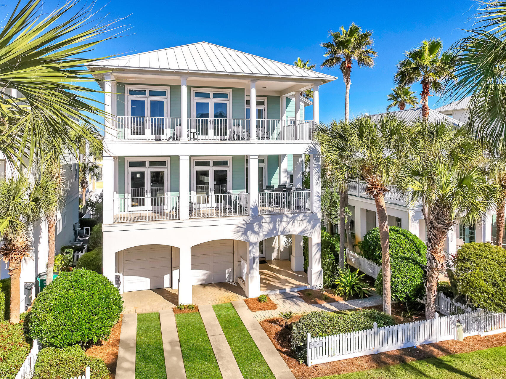 ''Slice of Paradise'' is this stunning home's name, and it is a fitting description for this ultimate beach vacation home. Let's start with location - directly across the street from the beach with gulf views from 2 levels of expansive balconies. Inside you'll find 6 bedrooms (2 of them bunk rooms), elevator, 2 laundry rooms and a LARGE living area and kitchen on the 2nd floor with more than enough space for large family gatherings. And after an afternoon at the beach, it's time to retreat back home to enjoy your private pool. Accessing the beach is a breeze with a beach access right across the street - slightly more than 100 feet away! 1st & 3rd floor wet bars and a garage turned game room helps makes this home the complete beach vacation experience! In addition to the home's private pool, there's also a community pool just a few streets away. 