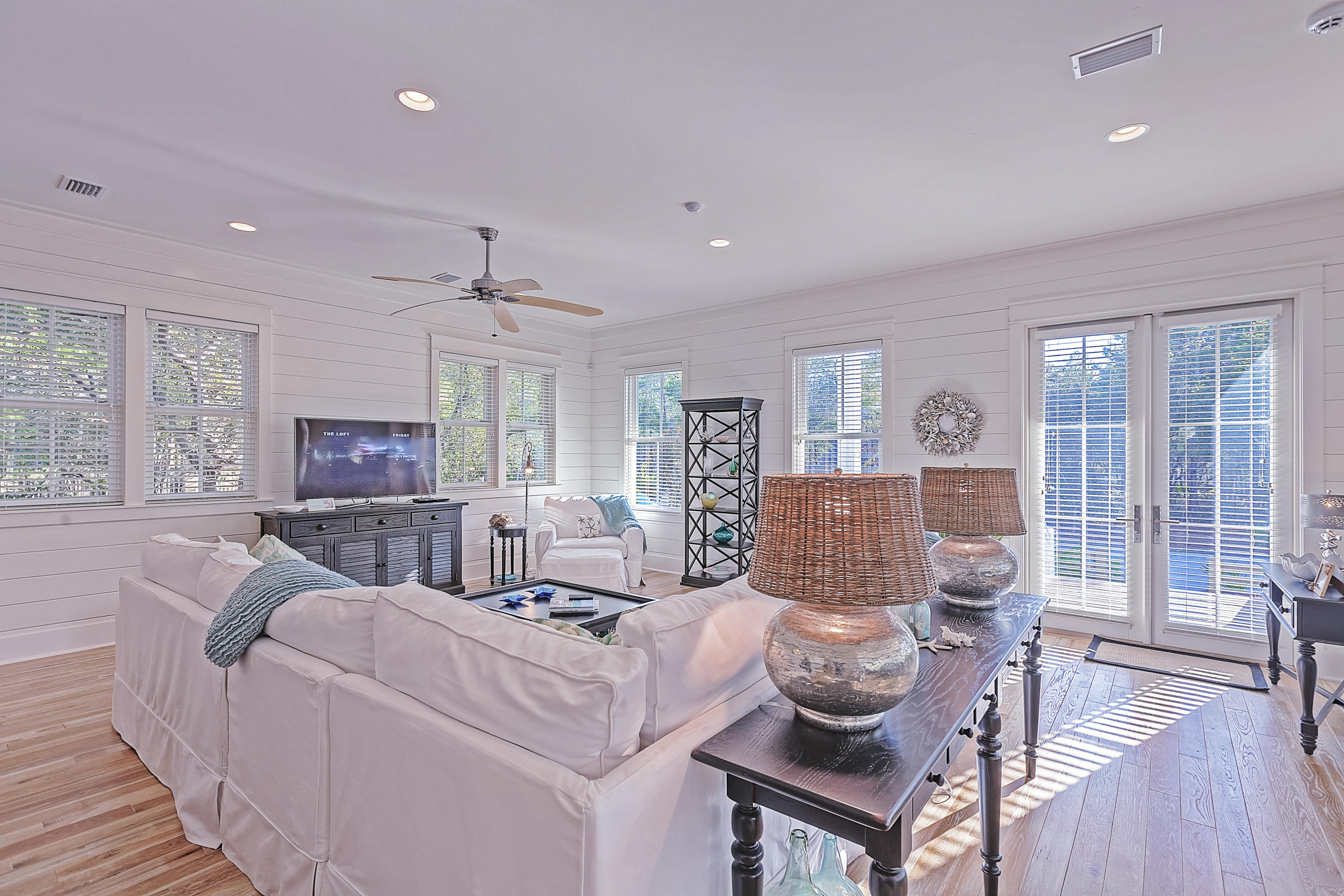 Immaculate attention to detail, unassuming elegance, ample natural light, screened in porch space overlooking lush green space, and location, location, location all characterize this WaterColor gem that has NEVER been on a rental program. It's in perfect condition! This home is not only located on a corner lot, but is just a stones throw from the Frog Pond Pool, perfect for those warm summer days. With 4 bedrooms, a bunkroom, 4.5 bathrooms, and 3,053 square feet of open-concept living space, this home has EXCELLENT rental potential. Large windows grace the entire home, allowing the sunshine to pour in! Built by a custom homebuilder in 2011, you can expect every finish was selected with attention to detail. A large marble breakfast counter, stainless steel appliances, a gas range, built-