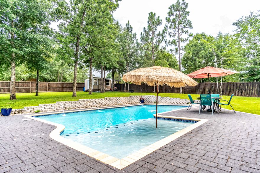 Welcome to your own private, backyard paradise! This beautifully updated 4/3 offers ample square footage with a flexible and open, split floor plan and sits on over 1/2 acre. No HOA! So, park your boat or RV with ease. Inside features a formal dining room and a flex room flanking the oversized foyer. The stunning kitchen boasts an island, granite countertops, stainless steel appliances, and ample cabinet space. The master suite offers 2 large, walk-in closets, garden tub, separate shower, and linen closet. The fourth bedroom has a private wing just off of the Florida Room. The backyard is an entertainer's dream with an open patio, gorgeous in-ground pool surrounded by pavers complete with fountains, a firepit, garden, and even a workshop! Also offering a 30 amp plug in for your RV!