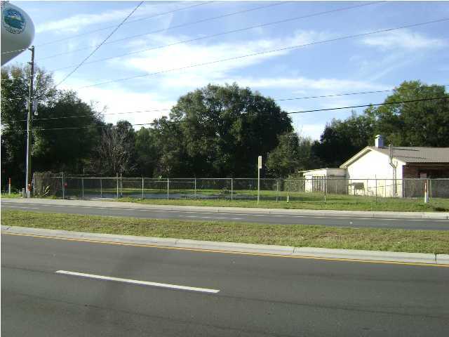 Cleared and fenced commercial property located on State Highway 20 in Niceville--just before Mid Bay Bridge access to Destin. Heavy and near continuous vehicle traffic on HW 20 makes this property prime time for varied sales opportunity. Easy and safe access/exit off of and onto newly improved and paved divided four lane highway. Water meter installed. An outstanding location. See possible site plan use (under documents) by commercial developent firm (based on current zoning). An outstanding buy. Take a look today!!