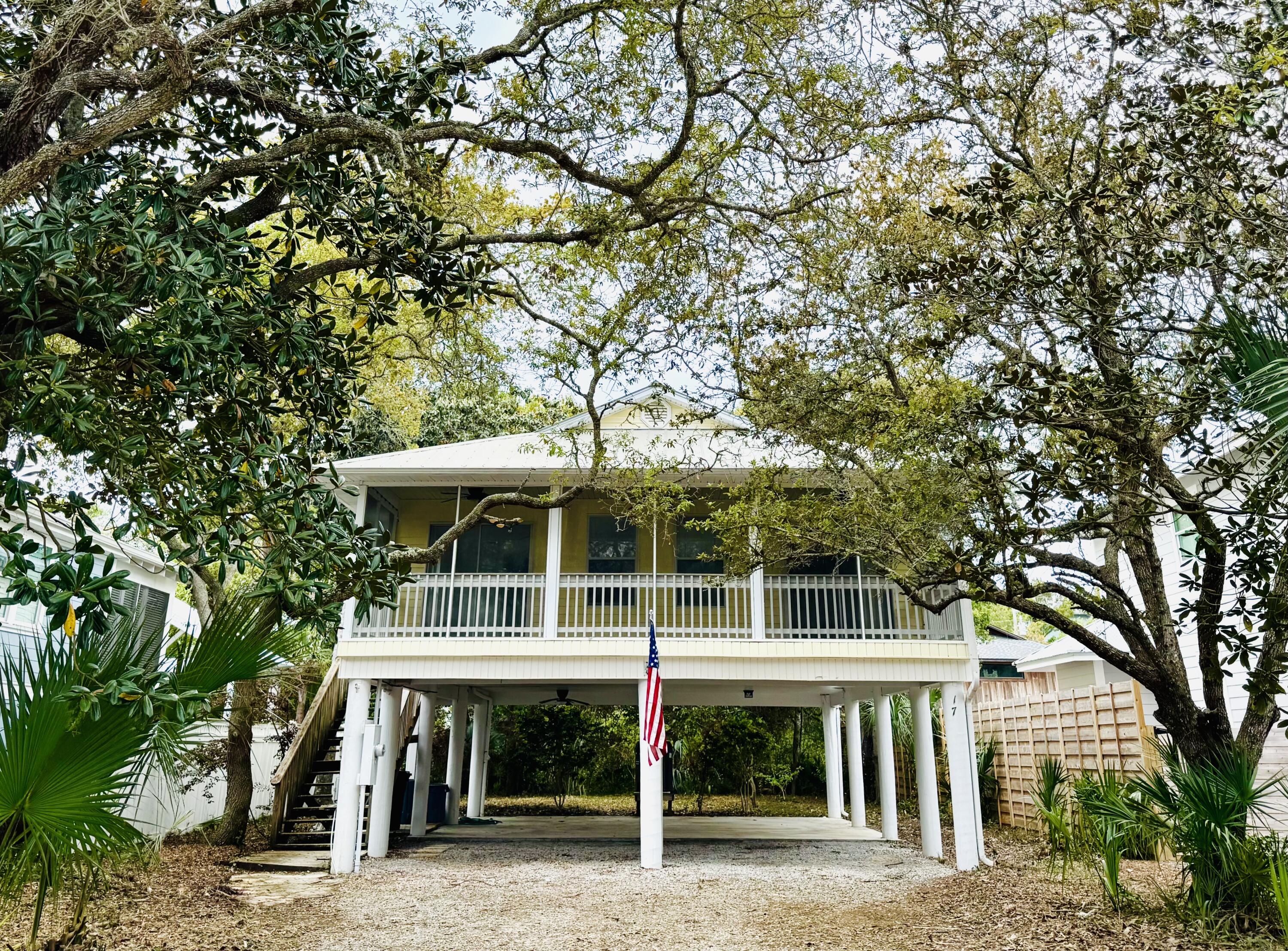 Located south of 30A and just under 200 yards from the beach, this charming beach cottage is perfectly positioned west of Eastern Lake in a picturesque, Old Seagrove-like area featuring sandy lanes and no HOA dues. Elevated on pilings, this single-story home offers a spacious living area that opens onto a large screened front porch ideal for enjoying the refreshing gulf breezes during summer. The master bedroom comes complete with a generous walk-in closet. This property offers ample parking and abundant backyard potential, including space for a pool on its 108x50 lot. Enjoy the ultimate beach lifestyle!