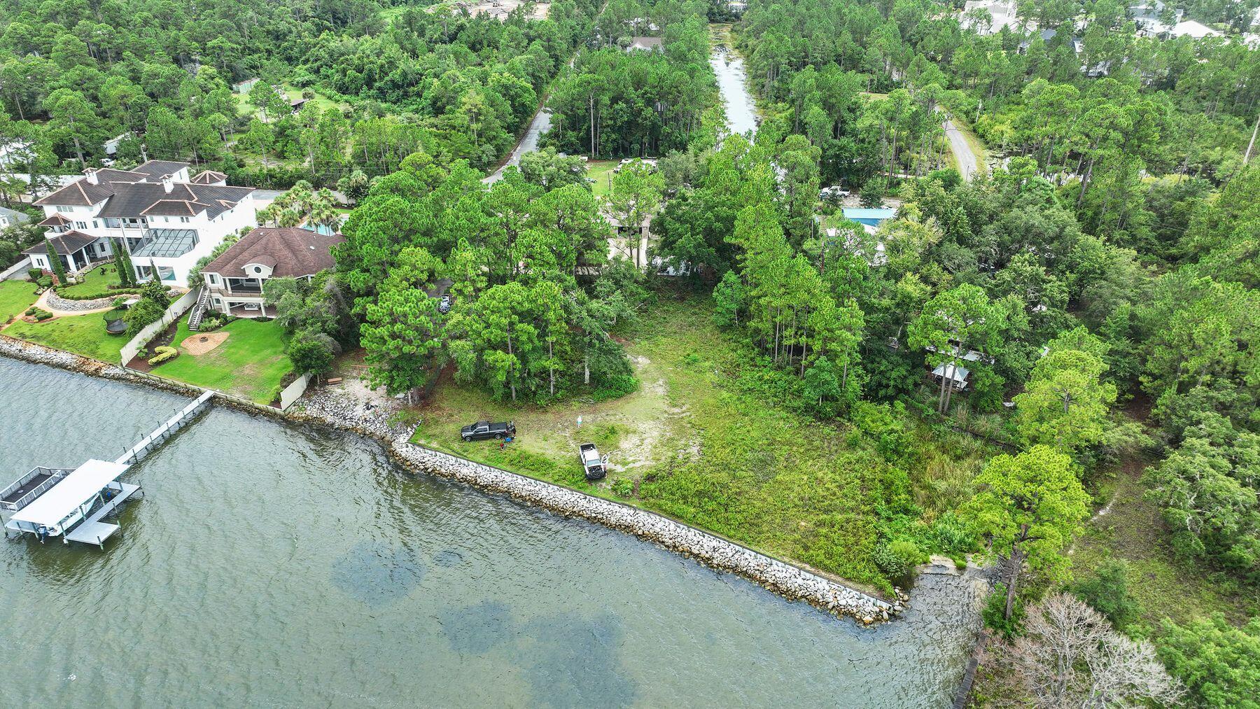 This site provides a substantial build zone for an impressive single family home. It may be purchased individually or ideally with the adjacent .23 acre lot to give even more ideal options for a family compound or two single family homes.An opportunity to have a dock and a great family home on the bay awaits. Rare opportunity to own a bayfront lots at the end of North Eden Park Drive, offering over 150 feet of waterfront on the Choctawhatchee Bay and approximately 0.53 acres. This unique offering provides an ideal canvas for building a private family compound home in a quiet, established neighborhood in Santa Rosa Beach.