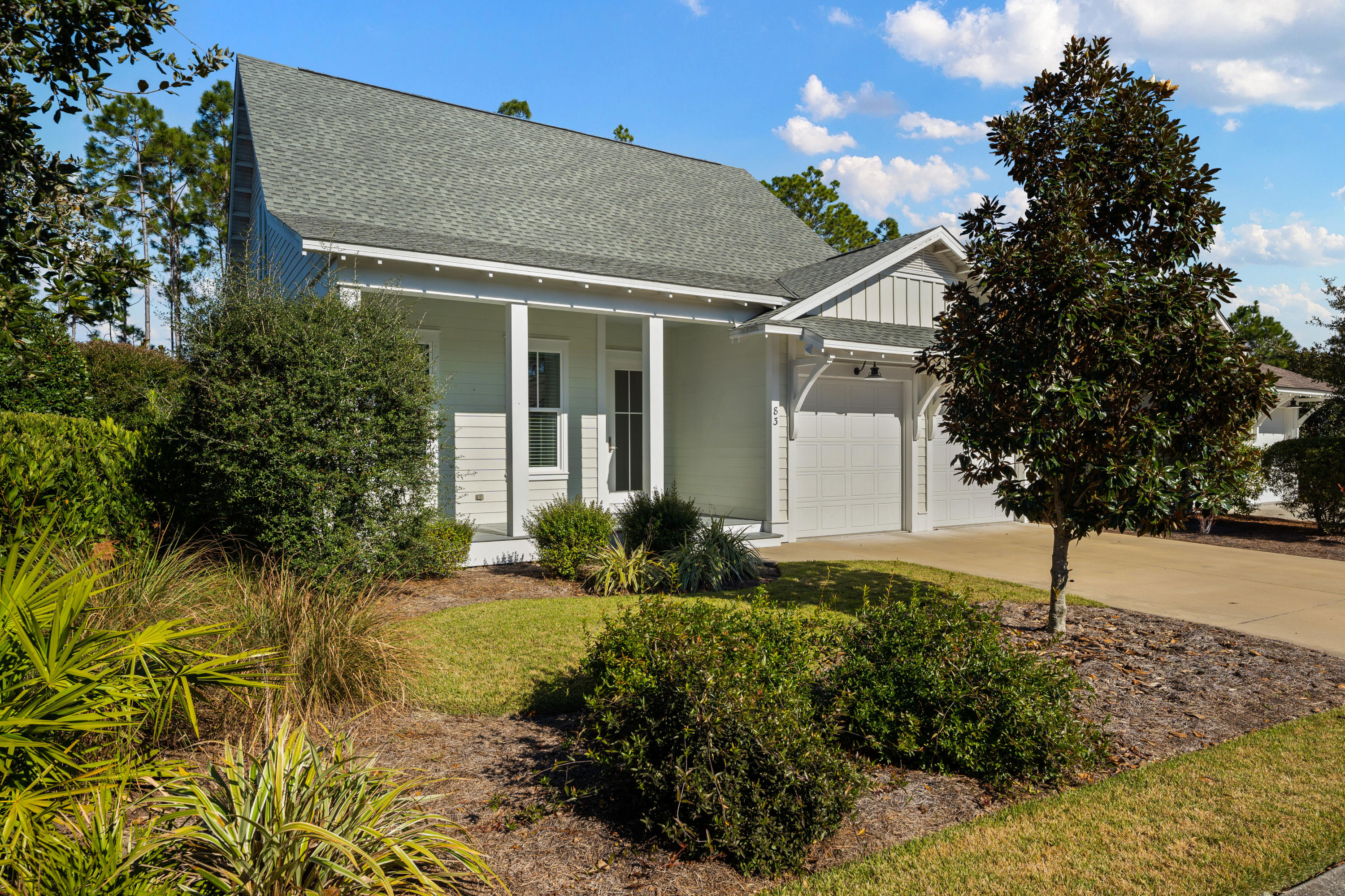This Watersound Origins Phase 1 charmer has a great open floor plan perfect for entertaining. The living/dining and kitchen areas flow out to a spacious screened in porch overlooking a fenced yard that leads to a community nature trail. The kitchen features white quartz countertops, gas range, large pantry and a built in bar/desk area. The master bedroom is perfectly situated on the main floor along with a secondary bedroom with an en suite bath. Upstairs are 2 additional bedrooms with a jack and jill bathroom. Origins is a short term rental restricted master planned community complete with a golf course, resort style pool, tennis and pickleball courts and a fitness center.
