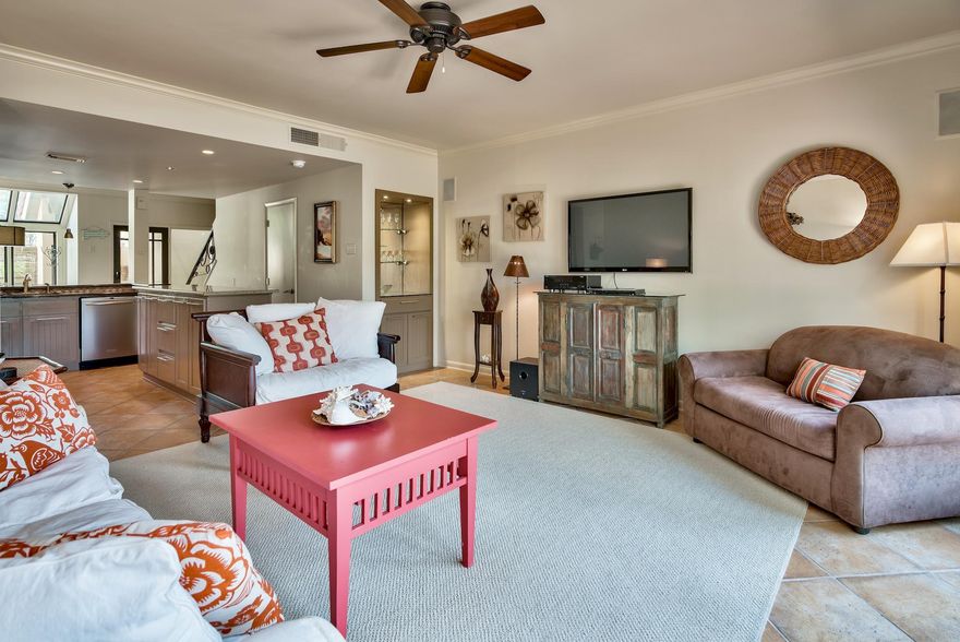 This nicely updated townhome in Beachwalk, is an ideal space for families and entertaining. Located close to the community pool and walkover that leads to the beach access. Redesigned to maximize the square footage and create amazing views throughout the living, kitchen and dining areas. The kitchen walls were removed and layout changed to create an open kitchen area, custom cabinets, stainless steel appliances, granite countertops with a large center island. The living area sliding doors were replaced with French Doors and give the unit a more sophisticated feel with plenty of natural light all overlooking a brick patio with wonderful views of lake. The Master bathroom layout was changed to add a separate shower and jetted tub. The guest bedroom has an Adorable extra ''crew bed''