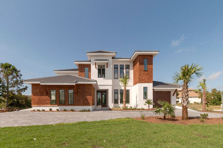 AGENT ACCOMPANY ONLY!New construction, perfect for the water enthusiast, 5BR/5.5BA home located on one of the largest lots on Holiday Isle. This home has the largest homesite slip on Holiday Isle at 57FT x 35Ft, which can accommodate a 75FT yacht with room for a boat lift/jet ski. Other features will include an inground pool, spacious outdoor living area, & 2 Garages. Inside you will find 2 master suites, 3 additional bedrooms, upstairs loft/bunk area, & a great room. Inside amenities will include Wolf/Sub Zero Appliances, quartz countertops throughout, 9'' plank hardwood throughout, central vacuum & upstairs/downstairs washers and driers. Built with cedar & stucco siding, spray foam insulation, & moisture proof sheetrock, no detail was left out. Just minutes from the beach, harbor & Gulf