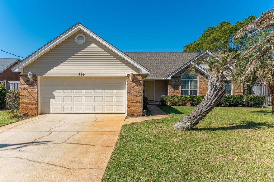 Welcome to this bright & inviting ranch-style home! In 2022 this home got a new roof, interior paint, tiled throughout (except for one bedroom). Enjoy the best of indoor-outdoor living with a huge, covered porch--half screened-in for bug-free comfort--plus an attached deck perfect for soaking up the Florida sunshine. The spacious yard offers plenty of room for play or relaxation with the privacy of an 8-ft fence. The cozy fireplace (wood burning, but currently has electric insert) & abundant windows create a warm & inviting atmosphere. The updated kitchen features granite countertops, a gas stove, & both an eat-in area and a formal dining room. The master bath boasts a new vanity and lighting, while the guest bath was fully remodeled in 2022. An indoor laundry room adds convenience to daily living. Located just 4.1 miles from Hurlburt Field, 15 miles from Eglin AFB, 9.2 miles to Navarre Beach and 9.9 miles to Okaloosa Island Boardwalk and beach. Don't miss this fantastic opportunity to own a well-maintained home in a prime location! Schedule your showing today!
