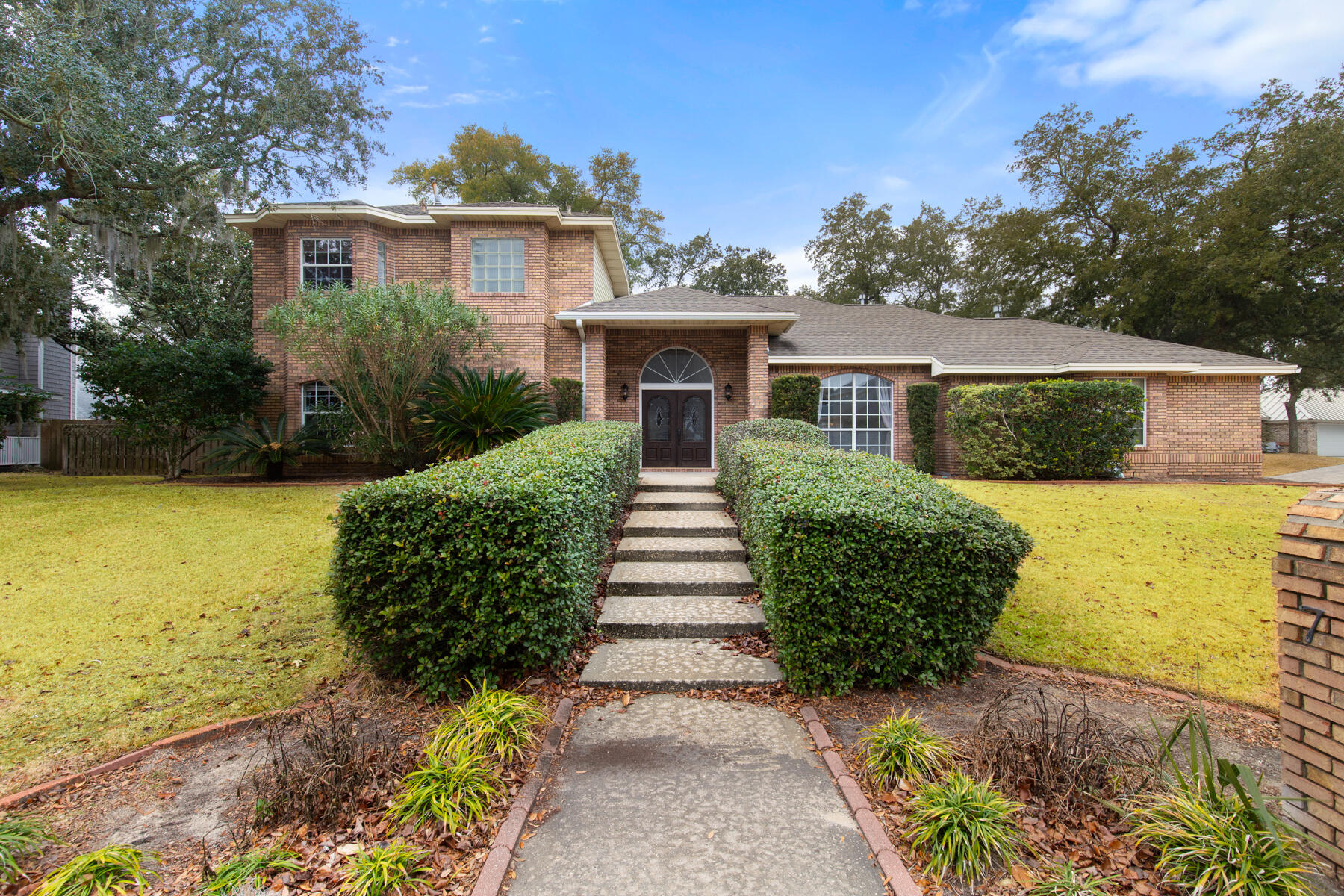 Welcome home to this stately residence on a corner lot. Enjoy bay breezes and a glimpse of Choctawhatchee Bay from this beautiful brick home situated across the street from the water. The double doors provide a very grand entrance to the vaulted ceilings and ample natural light. The kitchen features freshly painted cabinets, granite countertops, stainless appliances, pantry, breakfast bar and desk area. Dining options include a formal room and breakfast nook. The office is located opposite of the dining room and provides a wonderful bonus space. Large laundry room on main. Most every room has been freshly painted a soft white. Upstairs features a spacious master suite offering a sitting area, 2 closets, separate shower and jetted garden tub. Step out back to the 23x15 screened porch and large open patio. Located less than five minutes from two neighborhood beach accesses. Golf cart or bike to Meigs beach for sunset views, fishing, beach and boat launch. Conveniently located within 10 minutes to Eglin. Join the neighborhood tennis or golf club at Shalimar Country Club for all your active and social fun! 
HVAC 2015, HWH 2014. 