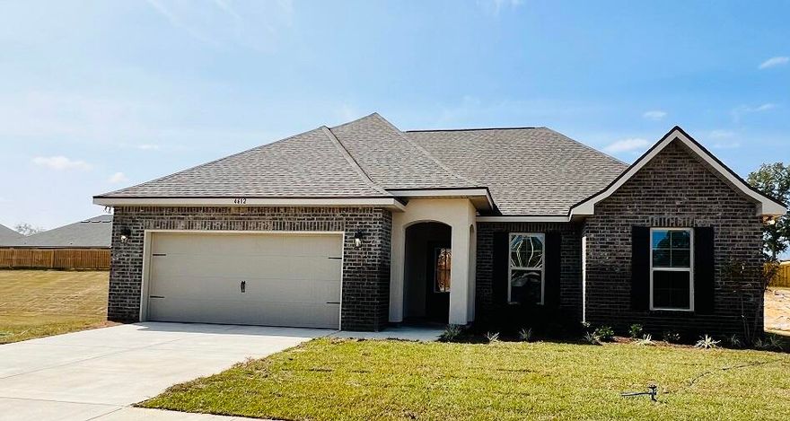 Awesome Builder Rate Incentives!  (Restrictions apply) The RAVENSWOOD V B in Patriot Ridge community offers a 4 bedroom, 2 full bathroom, open design. Upgrades added (list attached).Features: double vanity, garden tub, separate custom tiled shower, and 2 walk-in closets in the master bath, ceiling fan in living room and master bedroom, kitchen island, recessed can lighting in kitchen, covered porch and patio, crown molding, undermount sinks, framed mirrors, smoke and carbon monoxide detectors, landscaping, architectural 30-year shingles, flood lights, and more!Energy Efficient Features:  electric water heater, a kitchen appliance package with a electric range, vinyl low E MI windows, and more!