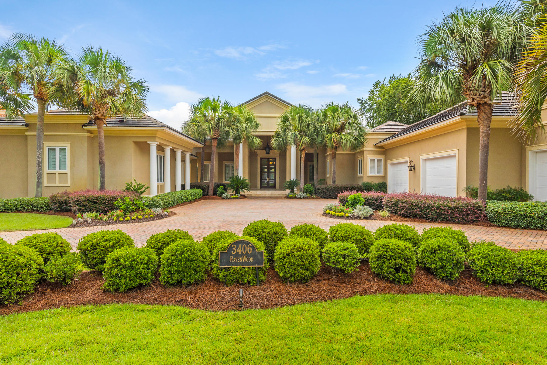 Elegant design elements flow throughout this stately resort home. Located in the coveted streets of Ravenwood. You will enter through beautiful glass inlaid double doors into a dramatic foyer, with vaulted ceilings and gaze directly out to a totally private enclosed sparkling pool, spa, outdoor kitchen,landscaped yard and lake enhanced with gracious royal palms. Beyond the privacy hedge is the 11 fairway of the exclusive Burnt Pine golf course. Highlights include five spacious bedrooms, all with en-suite baths, an inspired first floor master wing with en-suite bath w/ fireplace, spacious closet /dressing room upgrade, and a kitchen/family room complex with convenient bar, and separate carriage house for guest.