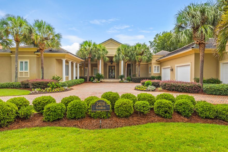 Elegant design elements flow throughout this stately resort home. Located in the coveted streets of Ravenwood. You will enter through beautiful glass inlaid double doors into a dramatic foyer, with vaulted ceilings and gaze directly out to a totally private enclosed sparkling pool, spa, outdoor kitchen,landscaped yard and lake enhanced with gracious royal palms. Beyond the privacy hedge is the 11 fairway of the exclusive Burnt Pine golf course. Highlights include five spacious bedrooms, all with en-suite baths, an inspired first floor master wing with en-suite bath w/ fireplace, spacious closet /dressing room upgrade, and a kitchen/family room complex with convenient bar, and separate carriage house for guest.