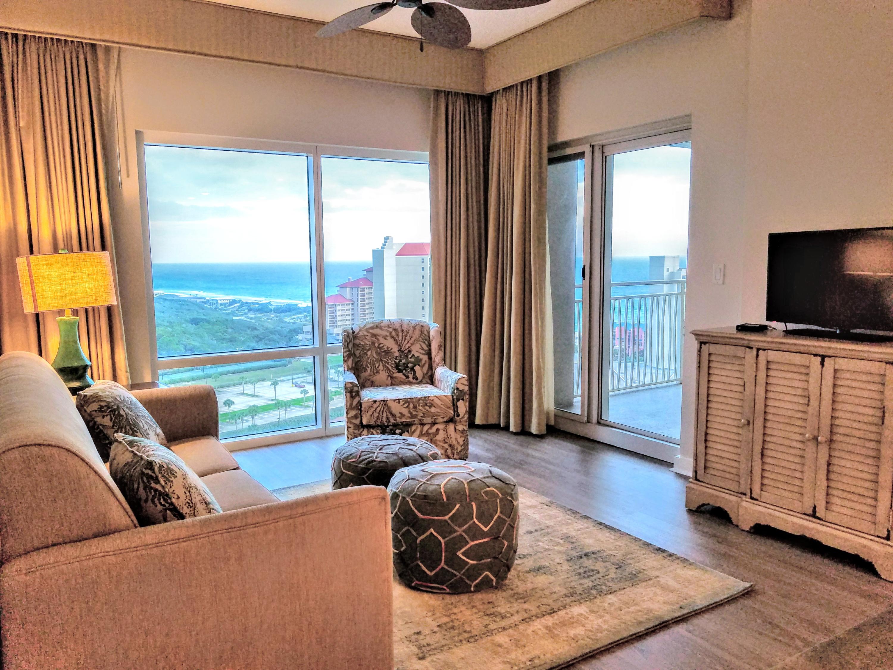 Wonderful panoramic views from the 16th floor of this east facing condo overlooking the gulf and the Tops'l Nature Preserve. Offered fully furnished and rental capable with a private owner's storage cage. Brand new AC unit installed September 2017! New wood flooring throughout, painting & furniture pieces installed Nov. 2017! Luau offers an oasis getaway with a heated pool, relaxing waterfall, hot tub, and grilling area. In addition, owners can take advantage of the sundeck on the top floor with its expansive views of the resort or burn some calories in the onsite fitness center.