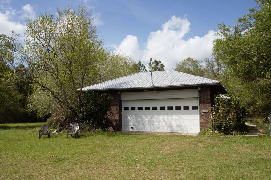 Quiet and serene is what this 28 acres will offer you. Bring your fishing pole for your pond. Raising chickens can be easy with this already established chicken coop. A new septic system in 2015, new deep water well in 2019, new metal roof installed in 2015, and new HVAC system in 2015. All the windows are double pain vinyl. Just imagine what it would be like swinging on the deck looking through the beautiful old oaks. The kitchen, dining and family room is open to each other so entertaining is a dream. Large utility room with a half bath and additional storage. If you need a formal space or an office the front room works great. Come put your personal touch into this solid built home. Buyer to verify all information. Home warranty for 1 year provided by the seller.