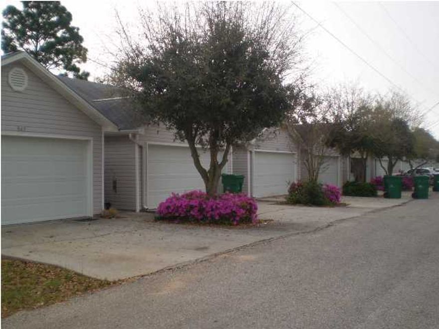 Great one story, two bedroom townhome with a two car garage! Laminate wood flooring in living room, ceramic tile in kitchen, baths, & hallway. Both bedrooms are carpeted. Nice size walk-in closet in master bedroom. Extremely quiet neighborhood and convenient to quick shopping and located between both military bases. Two car garage has plenty of room for two full sized vehicles. Don't miss out! Cat or small dog allowed with non-ref pet fee.