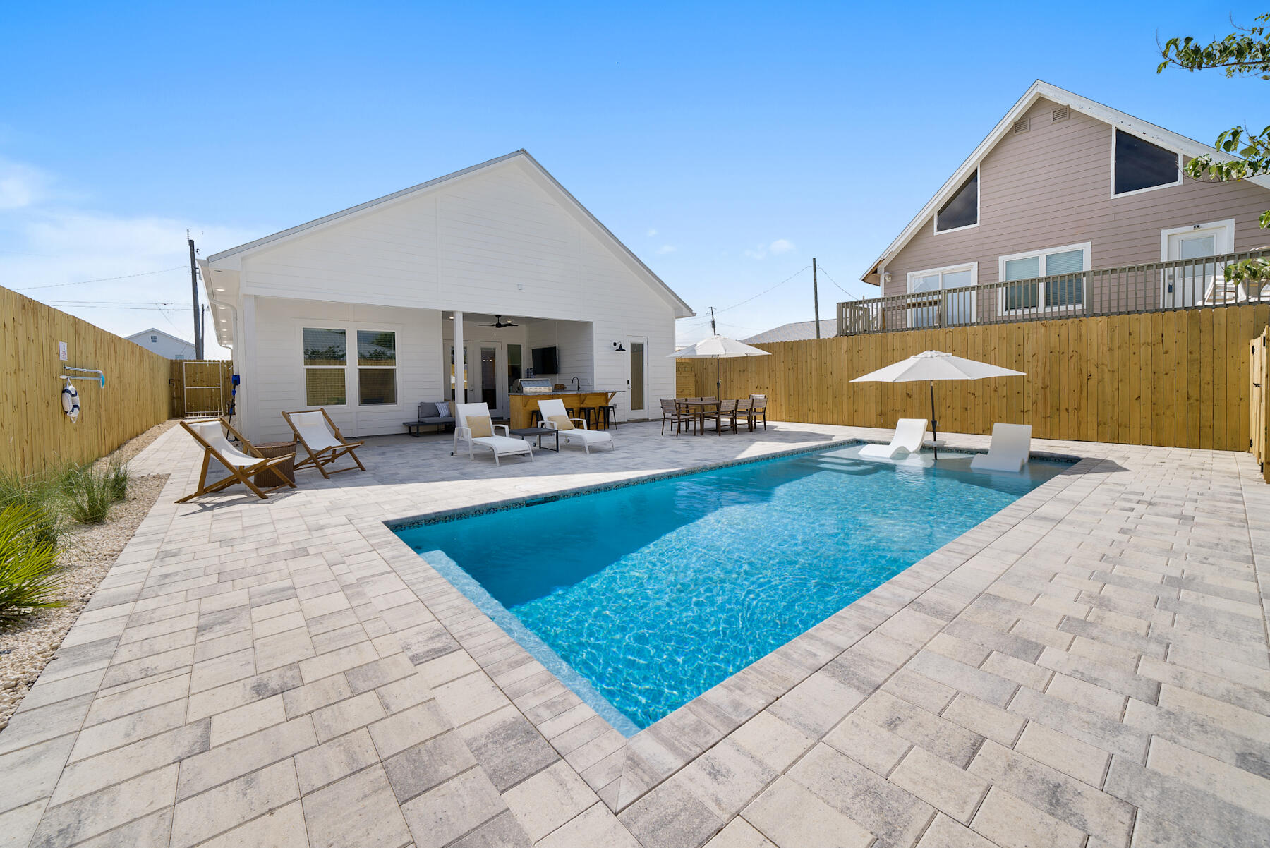 Welcome to 314 Tanaga Street, a stunning new construction (2023) home that perfectly blends luxury, comfort and investment potential.Located on a quiet cul-de-sac on the West End of Panama City Beach this property offers an incredible opportunity as a primary residence or a high-income short-term rental.4 bd w/add. flex room, 3.5 bth, 1,778 sq. ft., 2 car w/EC.10-ft ceilings, 8 ft door, HE light fixtures, glass tile, marble tile, custom Iron Front Door, gourmet kitchen, HE appliances, quartz countertops, custom cabinetry, wet bar.Luxury primary en-suite, dual vanities, zero entry shower, outdoor oasis w/ large heated SW pool, BBQ kitchen, 8 ft privacy fence.Low maintenance artificial turf, perimeter rock beds, zoned sprinkler. On STR program. Agent has equity