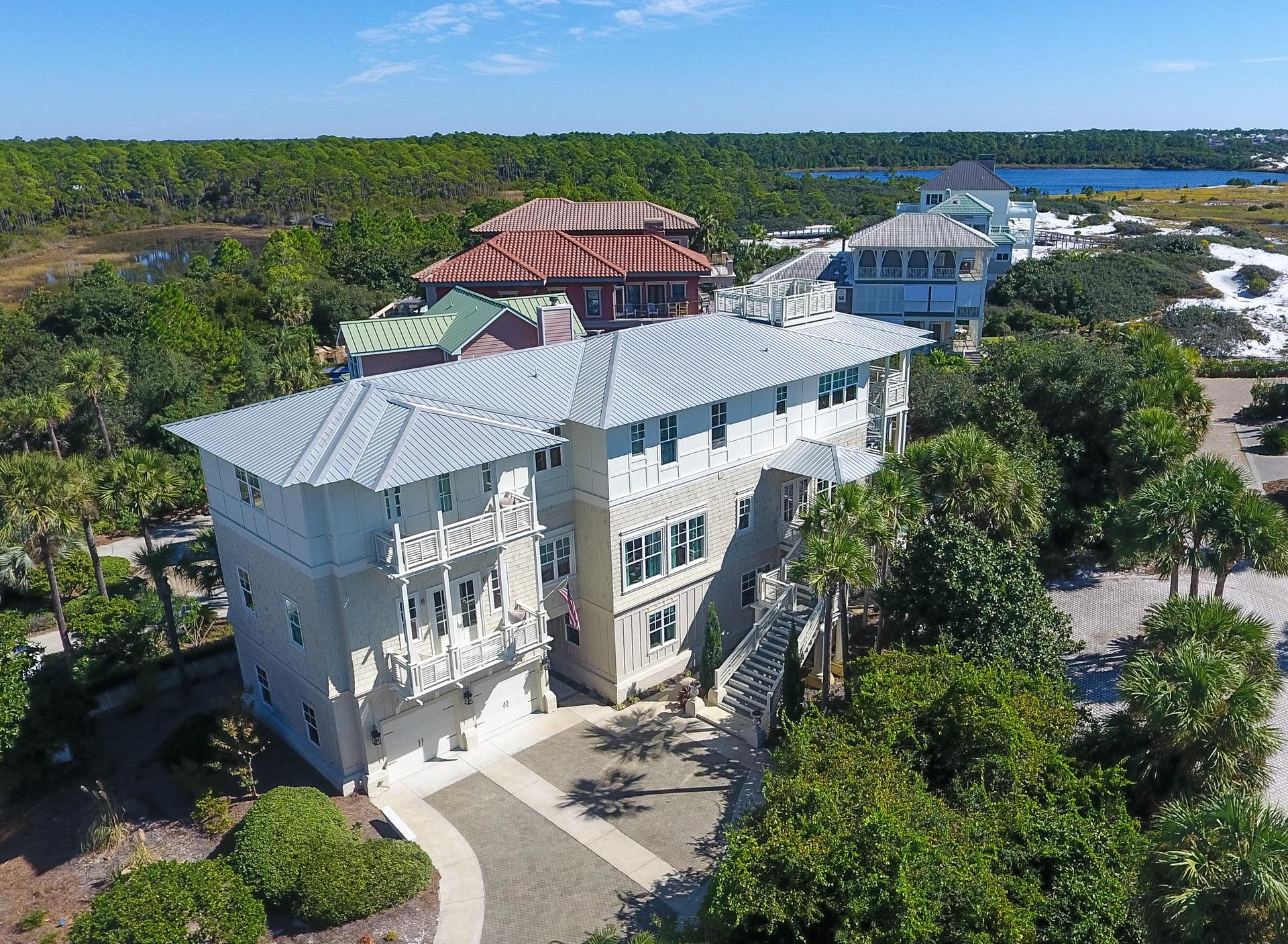 An established, strong cash-flow vacation rental, specifically designed for large groups, this vibrant beach house boasts a special, south of 30A location, just one tier from the Gulf , within the gated community of Seclusion Dunes. Conveying exceptional unobstructed and forever protected Gulf views over preserve lands, this 9 bedroom, 8.5 baths coastal beach house was completed in 2012, boasting an attractive design plan of 6,275 square feet of conditioned space & 2,213 square feet of additional covered space, focusing on impressive exterior spaces that marry outdoors with indoors. With attention to detail in designing the ultimate beach house, this rental machine will exceed $240,000 in rental income.