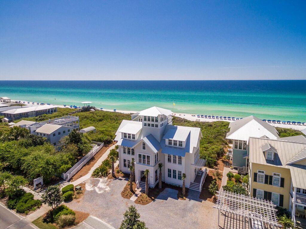 Exquisite, one-of-a-kind WaterColor home located south of Scenic Highway 30A! Designed by Stackable + Squires, developed by Cummings Development and built by Daniel Cole, this incredible coastal retreat features a reverse floor plan with an elevator to maximize enjoyment of Gulf views. Home has an enclosed heated saltwater swimming pool and a 4th floor cupola with breathtaking panoramic Gulf and community views! Designed to comfortably host large groups with 4,478 square feet, 5 bedrooms, 5.5 bathrooms and spacious living and media rooms. Special finishes such as wire brushed stained oak hardwood floors and 8'' v grove walls add character and charm with top end fit and finish throughout!