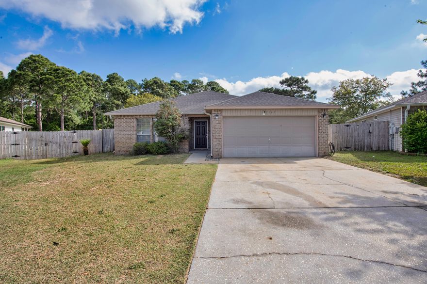 PRICE REDUCED! Dream Layout, Massive Lot, Minutes to Navarre Beach!Looking for space, comfort, and beachside convenience? This Promise Creek stunner has it all! Nestled in a peaceful cul-de-sac, this 3-bedroom, 2-bath beauty sits on an impressive .45-acre lot and is just 2 miles from breathtaking Navarre Beach.The thoughtfully designed split floor plan offers functionality and flow, with a large family room, spacious dining area, and a well-appointed kitchen featuring upgraded stainless steel appliances, gorgeous raised-panel wood cabinetry, and a stylish three-sided breakfast bar for casual dining. Just off the kitchen, a door leads to the laundry room and attached two-car garage, complete with attic stairs and garage door opener. Out back, enjoy your mornings or evenings on the screened 8'x10' covered porch, with direct access to your huge, private backyardperfect for pets, play, or even a future pool! Retreat to your expansive primary suite, where double doors lead to a spa-like bathroom with a garden tub, separate walk-in shower, water closet, and an amazing 12-foot walk-in closet that's sure to impress.
With schools and shopping just a short walk away and a builder warranty still in effect since its 2009 construction, this home won't be on the market for long. Call today and schedule your showing before it's gone!
