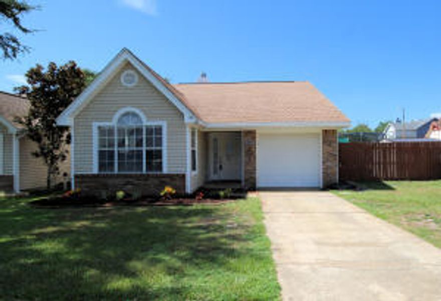 Adorable 3 bedroom, 2 bathroom home located just west of Hurlburt AFB front gate. Home has carpet in the bedrooms with wood vinyl flooring in the family room and hallway with a fenced backyard.   This home is approximately 15 minutes from beaches and shopping.