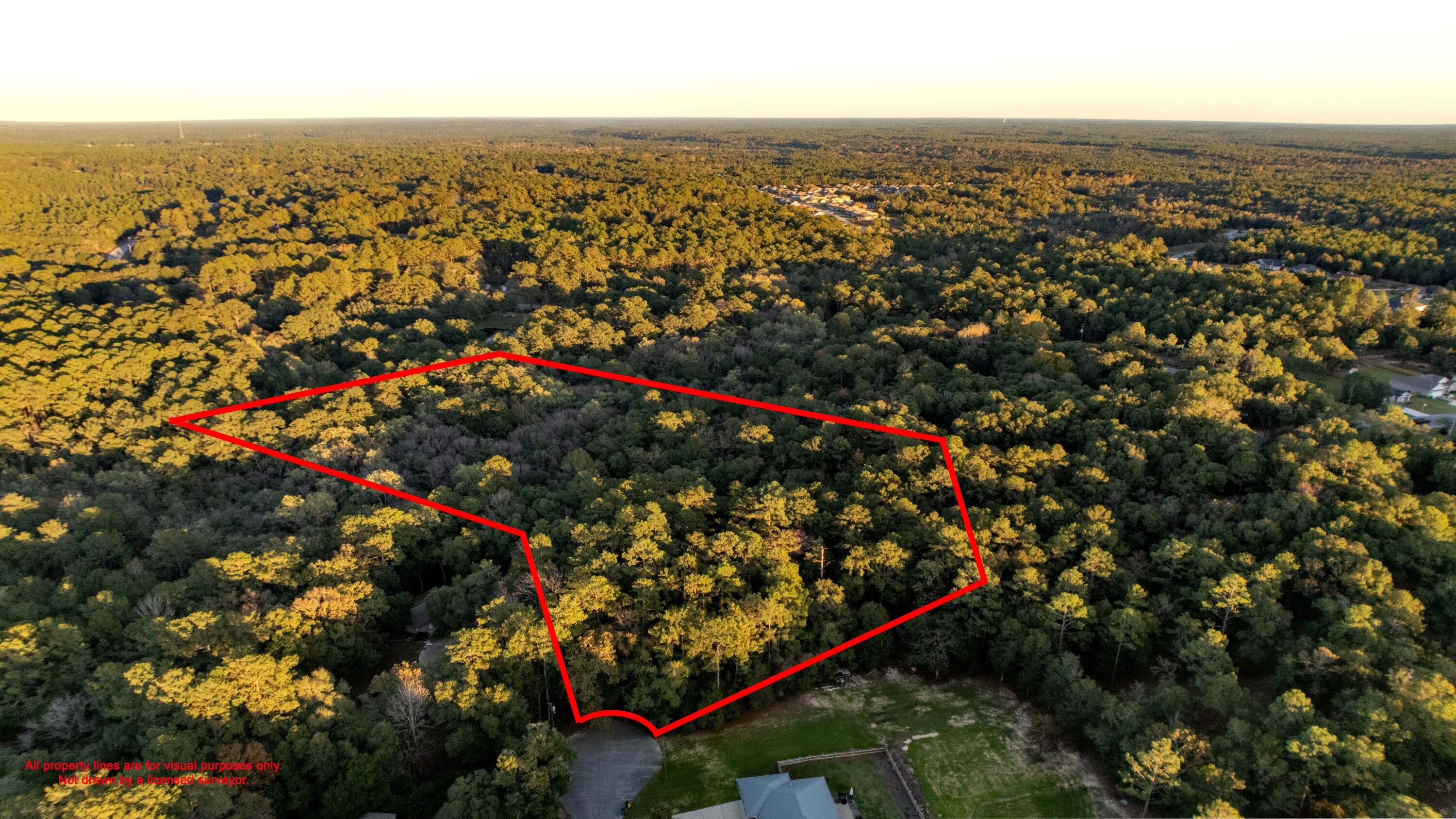 Discover your perfect slice of country living with this stunning 5+ acre vacant land in Crestview. Nestled in the picturesque Laurelwood Estates, this property combines tranquility with unbeatable convenience. Located on a cul-de-sac and as the last lot on the street, it offers added privacy and seclusion. Just minutes from North Crestview's amenities and a short drive to I-10, Hwy 331, and Hwy 90, this location provides easy access to both daily essentials and the beautiful Gulf Coast beaches. Step onto this enchanting property and be captivated by the natural beauty of mature trees and the peaceful creek flowing along the back. It's the ideal setting to design and build your dream home, creating a private retreat while still being surrounded by well-maintained homes in a charming neighborhood. Whether you're envisioning a quiet country lifestyle or a base to explore everything the area has to offer, this property has it all.