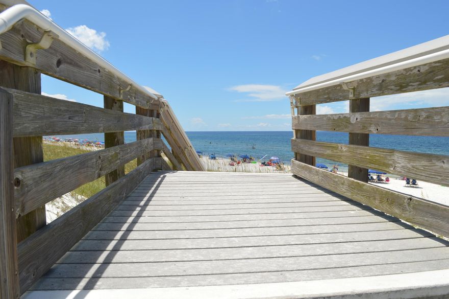 Walk to the beach from this Inlet Beach Home! Perfect for full time, part time or a vacation rental! Walk to the beach or bike to Rosemary Beach, 30A and the new shops and restaurants in Inlet Beach! This great home has a perfect layout, garage and awesome outdoor space. Your first level features an open floor plan, a convenient half bath, great storage and garage. The second floor has a spacious master suite with huge master bath and closet. The second bedroom upstairs is a second master with large closet and private bath, and a built in murphy bed that stays. The sellers have upgraded this home with new light fixtures, impact windows on all upstairs windows, new exterior doors with built in blinds, fenced in yard, paver patio, hardwood floors and more! Call Today! that stays with the home.  The laundry room is also conveniently on this level.  One of the best parts of this home is the outdoor space.  Enjoy a covered patio out back and a space for your patio table, outdoor seating, your grill, a firepit, and even a garden box for growing plants or vegetables.  This home really does have everything wrapped up in a "small" package.  Call today!