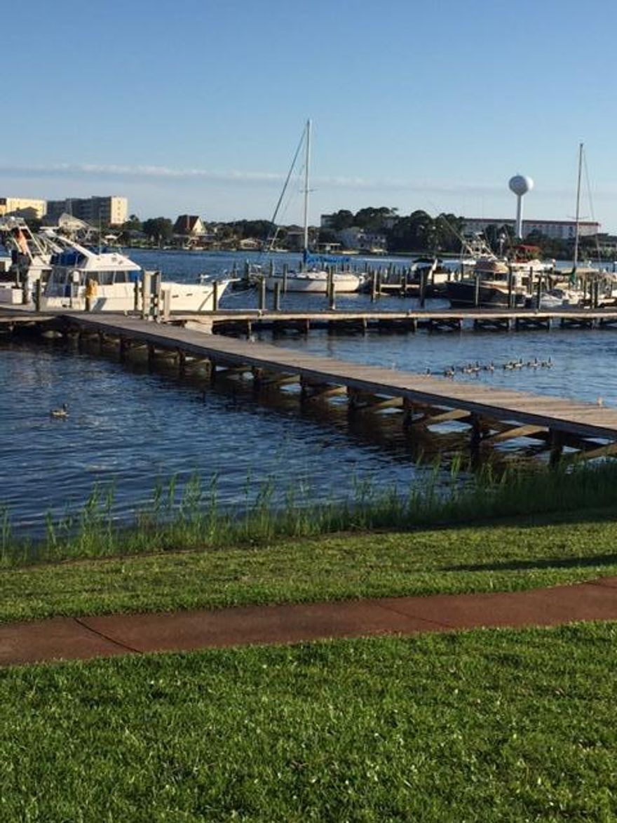 MAJOR PRICE REDUCTION. YOU'RE GONNA LOVE THIS FANTASTIC WATERFRONT, ONE- KING SIZED BEDROOM, TWO-FULL BATH CONDO WHICH ALSO HAS, A VERY NICE FULL KITCHEN, LIVING ROOM WITH SURROUND VIEWS OF THE WATERWAY, WRAP AROUND PATIO'S.. AND.. THREE LARGE PATIO DOORS, PLUS A WINDOW AREA, ALL OVERLOOKING THE WATERWAY, POOL, AND GROUNDS. ALSO INCLUDES AN ASSIGNED 36FT BOAT SLIP #D03, AND A 10K LB BOAT LIFT.THE INTERIOR OF THE CONDO IS VERY NICELY UPDATED AND FURNISHED THROUGHOUT. YOU'LL LOVE THE FULL KITCHEN, GRANITE COUNTER TOPS, STAINLESS STEEL APPLIANCES. WASHER/DRYER, BEAUTIFUL FURNISHINGS, GREAT PATIO FURNITURE AS WELL.ASSOCIATION DUES COVERS: WATER, SEWAGE, TRASH, CABLE TV W/2-HBO'S, HI-SPEED WIRELESS INTERNET, INSURANCE ON THE BUILDING STRUCTURE (WIND, FLOOD, ETC.)..... AND MORE