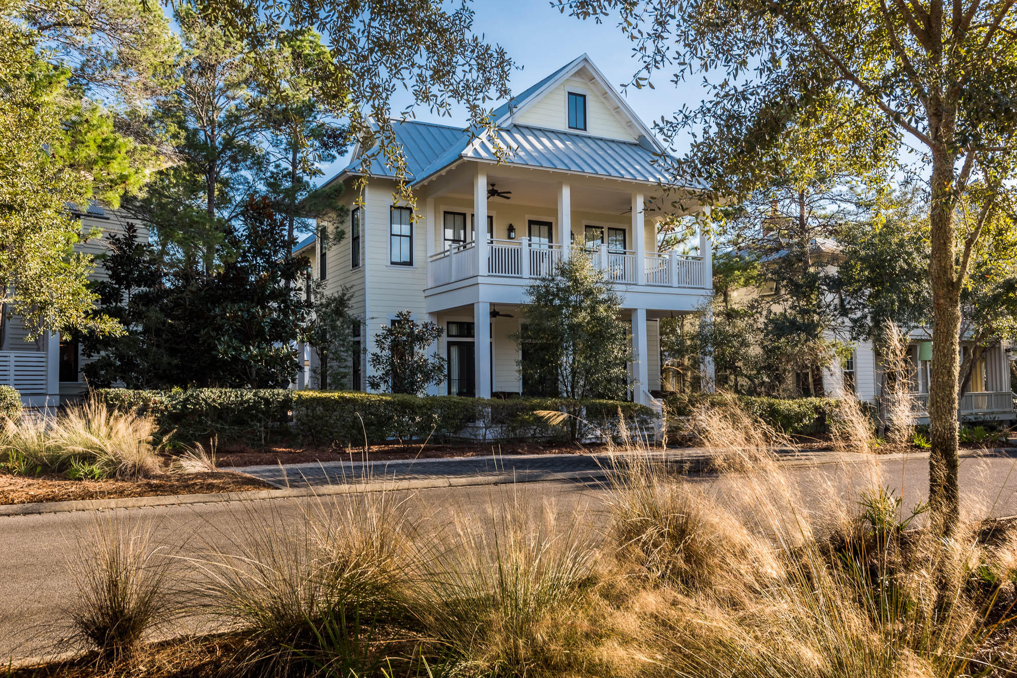 This charming 5 bedroom, 4 and -1/2 bath beach house found in Sand Hill, phase three of WaterColor, welcomes guests with an expansive, covered porch with abundant seating for your guests to gather and enjoy the mild Florida evenings. As you enter this home's sprawling great room with soaring ceilings, your gaze will be met by capacious windows letting in scores of natural lighting. The spacious living area was made to gather; a great spot where memories can be made for years to come. The large dining area with seating for eight provides another gathering spot where your family will continue to create memories over meals together for many generations to come. The open concept kitchen with stainless steel appliances, a Thermador 6-burner gas range and vented hood,