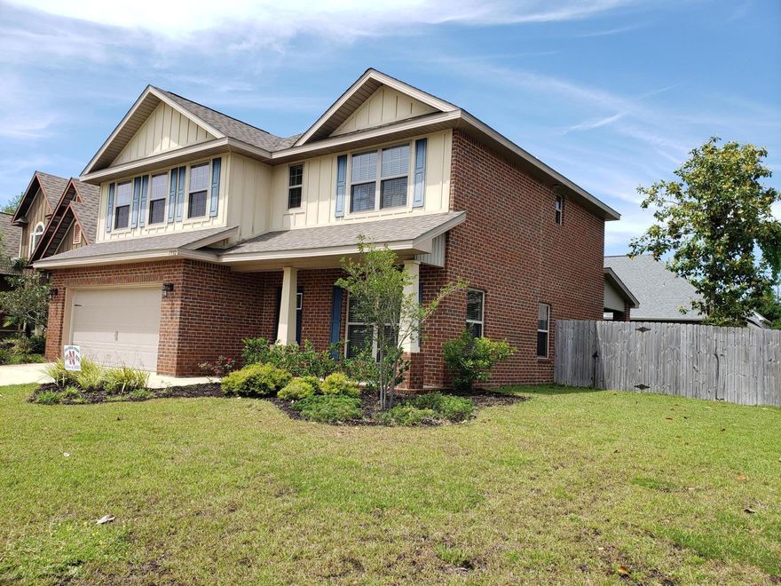 PRICE REDUCED! -Motivated Sellers!Welcoming beautiful 4 BDR 3.5 BTH (like new) 2 Story Brick Home in Magnolia Village is corner lot location- South of Hwy 98 Navarre- Ideally located minutes to Hurlburt Field, Navarre/Gulf Breeze Beaches,& award winning Santa Rosa Co Schools.Greeted w/ large yet secluded front porch, Home opens up to large family room, open kitchen w/ All 2014 stainless-steel appliances, spacious granite counter tops, & breakfast bar. Dining Room for a banquet table w/ view to your large covered patio & privacy fenced backyard,perfect for entertaining & summer BBQs! Spacious 1st Floor Master Suite w/ ample space for king size Bed & plenty storage space -2 walk-in closets. Upstairs: large open space perfect for an additnl Family/Recreation Room.(click more to view)