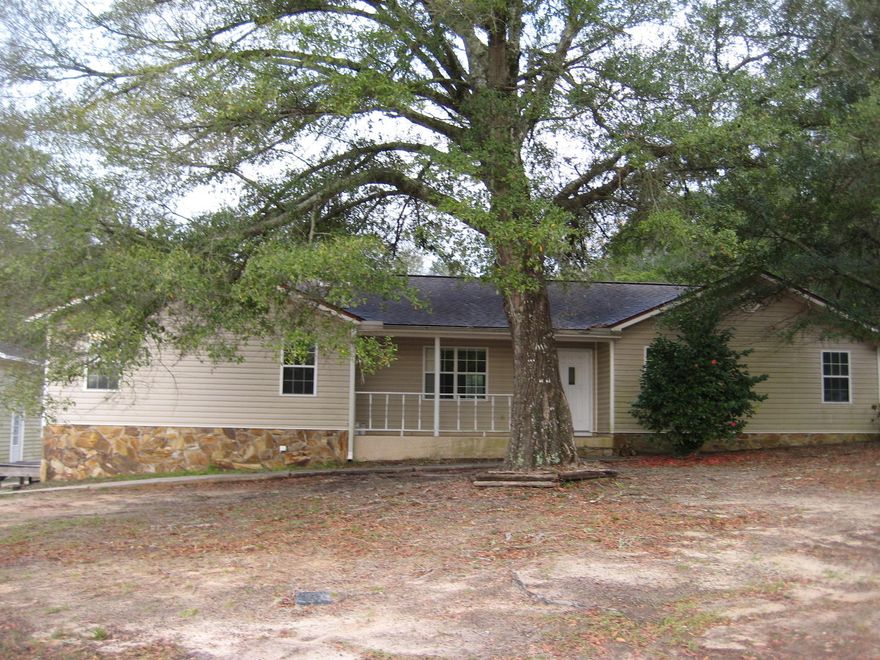 Brand new roof installed October 1st 2017!!! Motivated seller and priced to move! Conveniently located 3 bedroom and 2 bath home in the heart of Crestview! Low-maintenance vinyl sided home on over half an acre right in town. Living room features wood laminate floors, beamed ceilings and a great stone fire place and opens to the kitchen which features a breakfast bar and plenty of cabinets and counter top space for the cook in the family. Master bedroom is very roomy and walks out on to the back deck over looking the private yard. Master bath features dual vanities and a stand alone shower.