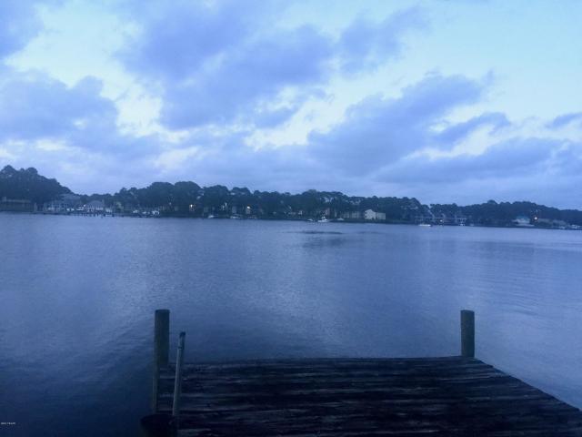 Huge price reduction! Beautiful parcel of land on the Grand Lagoon. 71x163x17x171 0.277 Acres. Public boat launch at Safari St only 2 lots away. Uncertain of condition of dock so please stay off. Parcel 1 on Survey.orginally one parcel made up of 2 lots and 30' of 3rd adjacent lot. split to two equal sized lots and then had to switch back to original lots as originally platted. Lot 38. Survey available
