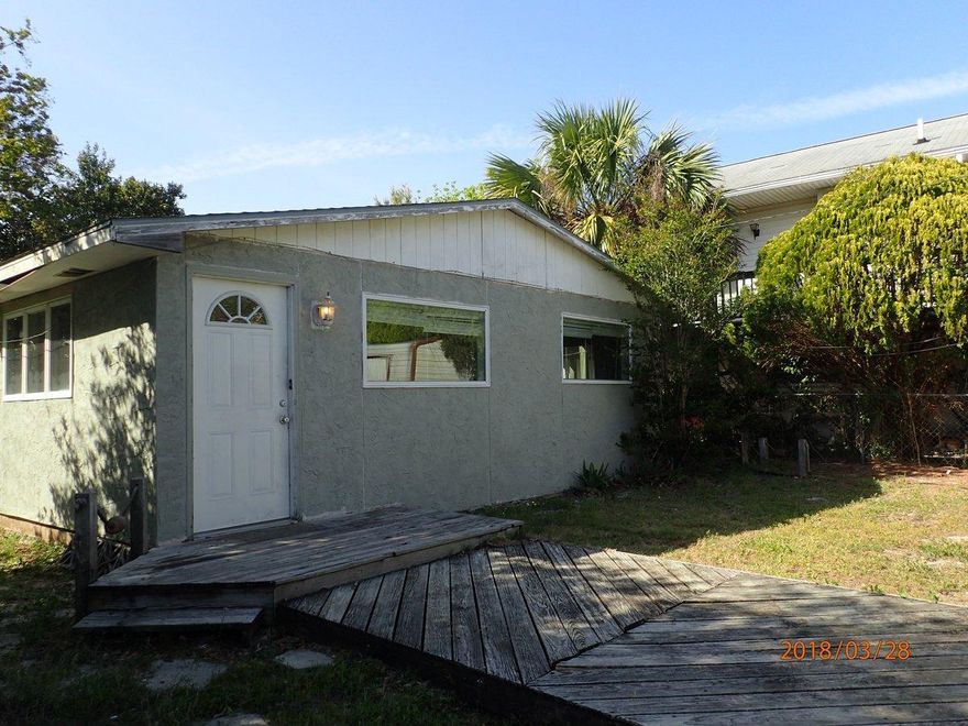 This REO property is located in the popular Laguna Beach area just off Hwy 98 and walking distance to Gulf of Mexico. 2 homes are located on this lot! The SF is the combined SF of both homes combined. Home 1 at the front of the parcel Has stucco/wood exterior 2 bedrooms, 1 bath and a small kitchen. This home needs extensive repairs. Home 2 which rests at the rear of the home was very recently used as a rental property and has slab substrate, 2 bedrooms 1 bath, kitchen, laundry room, living room and bonus room which can be used as a 3rd bedroom. This unit is all tile and comes with stucco siding and central air. Call today to set up your viewing!