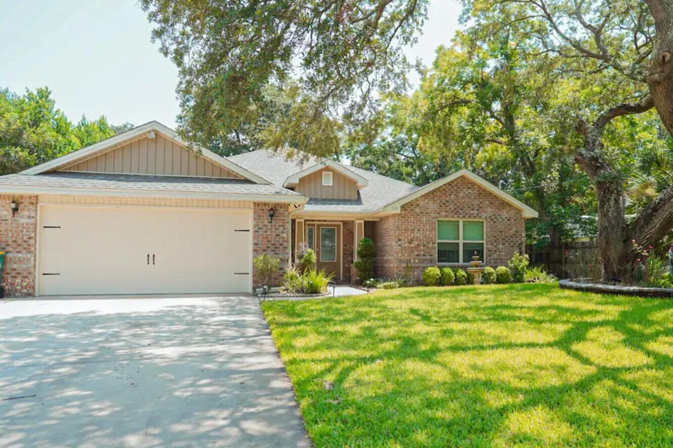 Custom 4-bedroom, 2-bath all-brick home is the perfect place to call home in Fort Walton Beach! Open floor plan is ideal for entertaining, w/living room featuring trey ceilings & custom lighting. Kitchen offers granite countertops, stainless steel appliances, breakfast bar & pantry--all flowing seamlessly for gatherings. Master suite boasts a trey ceiling, dual vanities, soaking tub, walk-in shower & expansive walk-in closet. Outside, enjoy a covered patio w/bench swing, firepit & privacy-fenced backyard perfect for relaxing evenings or weekend cookouts. Oversized driveway & gated parking pad provide space for RV, boat or extra vehicles. Close to shopping, dining, schools & the sugar-white sand beaches of the Emerald Coast. This home combines style, comfort, & a sought-after location.