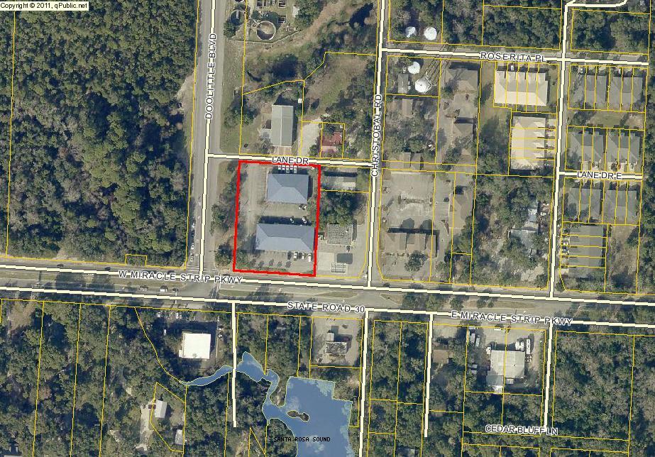 New price considerably below the most recent appraisal value! Great corner parcel right on Hwy 98 - the main thoroughfare between Pensacola and Panama City. The lot is 1.25 acres and currently has two buildings: the retail shopping center is 8400 sqft and the office building is 5400 sqft. The property can stay as an investment property and be redeveloped.