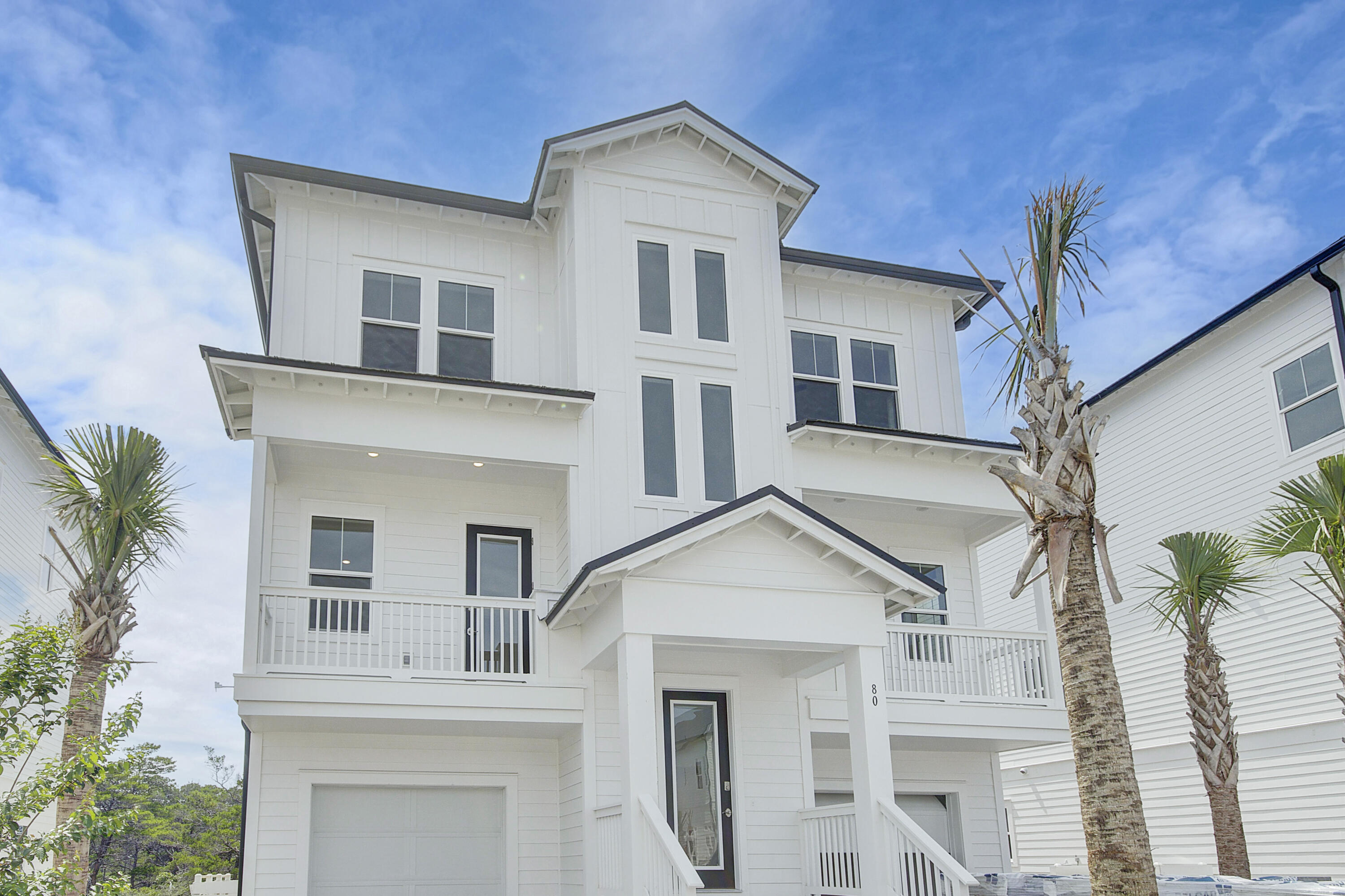 Welcome to the Cape at Bluewater Landing, a contemporary coastal home that is the ideal beach getaway. With a spacious floorplan of almost 4000 sq ft, this beautiful residence features 5 large bedrooms, 6 full bathrooms, and 2 flex spaces, all complemented by 2 single-car garages. The residential elevator keeps each story accessible to anyone. Take in the sunshine and breathtaking views from one of the oversized balconies or gather in the open plan living room for a relaxed and comfortable lifestyle. The expertly designed kitchen, complete with a large island, provides both functionality and style, making it the perfect space for entertaining guests. With thoughtful design elements that ensure privacy for all, this is the perfect place to call home.