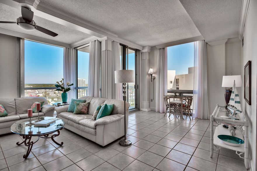 Introducing Shoreline Towers 2121 - A large 1800-SF, 3 BR/2 BA penthouse unit on the 12th floor of desirable of Tower 2 at Shoreline Towers. Located in the heart of Destin on Holiday Isle, with Gulf, Harbor, and Bay views. Stunning at night to see the City of Destin laid out before you. Shoreline Towers is in close proximity to top restaurants, recreation, and retail. There is 460 feet of pristine beach frontage, with a new beach walkover located directly from Tower 2.
Tower 2 at Shoreline Towers is positioned Gulf-front and this penthouse unit, while not directly Gulf front, offers fantastic Gulf views and expansive views of the city of Destin including the Bay and Harbor. Another rare treat is covered parking with an assigned parking space in the garage and assigned storage. The assigned storage closet is located on the 12th floor close to the unit just by the elevators and is perfect for storing beach gear. There is also an owner's closet inside the unit by the entry that can be locked out. Additionally, a heated and cooled 9x6 storage area on the ground floor of the parking garage may be applied for through the Association for a one-time $500 fee. Perfect as a permanent residence or vacation home/rental, Unit 2121 has 9 1/2-foot ceilings throughout, floor to ceiling windows in the living area, with an outside balcony area offering exquisite views. In addition to having the extended ceiling height on the penthouse level, at 1,800 square feet, this is the largest floor plan at Shoreline Towers, making this unit ideal for primary residence. The unit was JUST PAINTED throughout for a fresh look, has a newer HVAC system and is being sold fully furnished and decorated. If desired, the unit can be renovated to open up the kitchen to the living area. Interiro features open living areas with a wood-burining fireplace, three spacious bedrooms - two with Gulf views and a master bedroom that has a private bath & dressing room. Interior pantry and owner's closet storage can be locked as an owner convenience. This unit was recently on the Shoreline Towers onsite rental program and rental history can be provided. Currently it is not on the rental program to facilitate showings at any time.

Shoreline Towers is a gated resort that offers large grounds, a heated pool, sauna, fitness center, recently updated large community clubhouse with full kitchen & bar that can be reserved for your private functions or social events, BBQ and picnic area, a fishing lake, two lighted tennis courts, shuffleboard, 24-hour security and patrol with a guarded gated entrance, onsite rental and HOA management offices. There is an additional parking area for boats and RV's and this complex has a handicap accessible beach walkover as well as entry to the pool. There is a no pet policy. You are in a prime location in Destin close to many dining, shopping & entertainment options. 

This is a great opportunity to own a penthouse level large 3BR condo in central Destin for well under $400K. Schedule your viewing SOON and live the Destin lifestyle in spacious and serene surroundings!