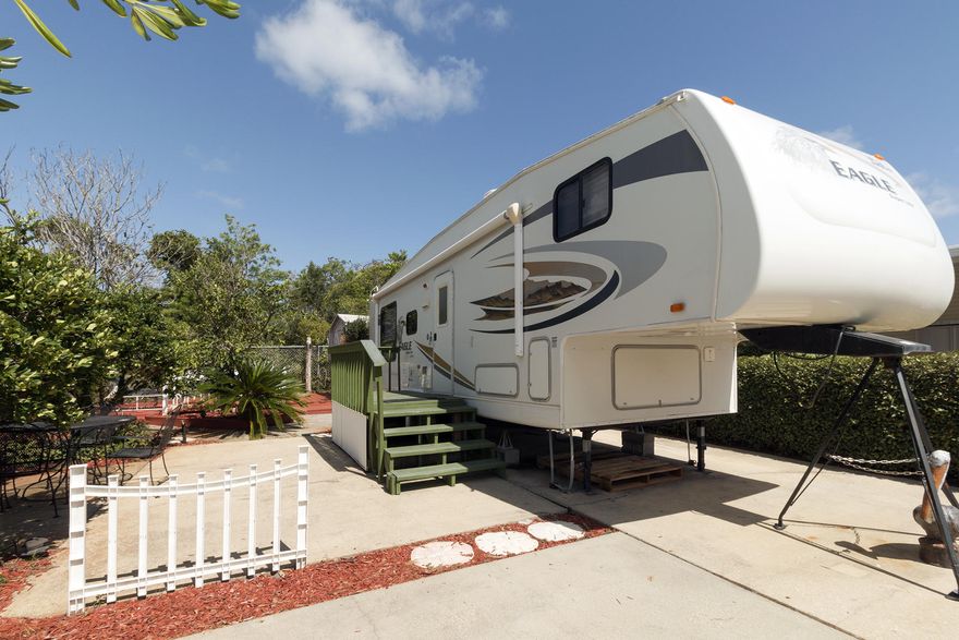 Located just 2 blocks from the beach, Bradley Park is a 14 lot RV type park. This lot & 5th wheel RV is located on a 30 x 80 lot. Quaint & quiet, this lot features 5th wheel RV, 2 large decks, & a storage shed. The 5th wheel features a kitchen area with gas stove, microwave, & refrigerator; living & dining area with built in couch & dining table; & bedroom with queen sized bed, shower, & bathroom. Other features include a washer & dryer. Each owner is responsible for their own insurance. Each owner has 1/14th ownership in the common area.