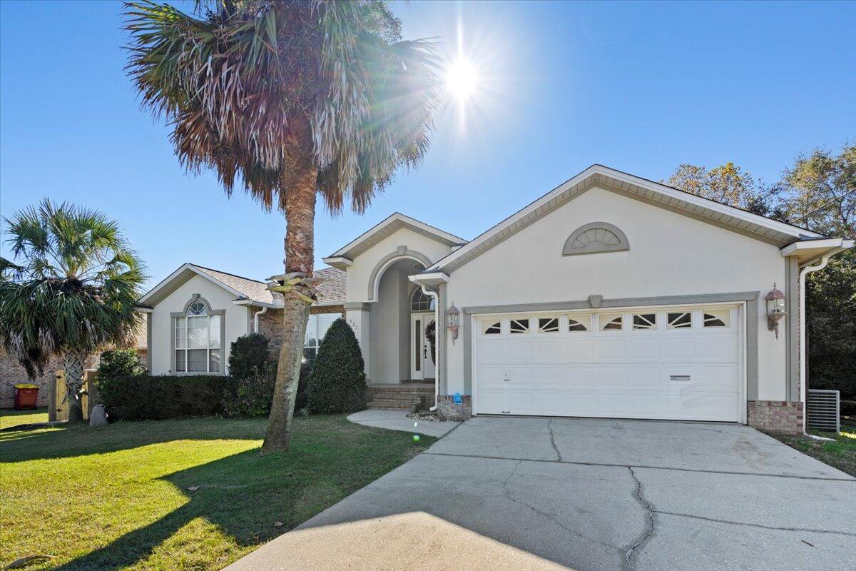 Nestled south of I-10, this spacious and meticulously updated home offers the perfect blend of comfort, style, and convenience. Just minutes from Duke Field, Eglin AFB, and the Emerald Coast, it's an ideal retreat for anyone seeking proximity to work and play.This 5-bedroom, 3-bathroom gem boasts over 2,500 square feet of living space, featuring a finished walk-out basement that opens directly to a luxurious gunite pool with a built-in hot tub and fountain. The pool area is fully enclosed, making it perfect for year-round relaxation or entertaining. The lower level offers two bedrooms, a full bath, and a family room, creating a private oasis for guests or multi-generational living. 
The main level is equally impressive with three additional bedrooms, including a spacious master suite. The master bath is a spa-like retreat, featuring a cultured marble garden tub, separate shower, dual vanities, and a large walk-in closet. The open and airy design includes raised and vaulted ceilings, an elegant formal dining room, and a sunny breakfast nook with access to a charming covered patioperfect for your morning coffee or evening relaxation.

The kitchen is centrally located and has been completely upgraded with tiled floors, granite countertops, and new appliances, making meal prep a delight. The entire home has seen thoughtful updates, including new flooring, modern lighting, knockdown Spanish lace ceilings, and a high-efficiency HVAC system.

What sets this home apart is its state-of-the-art solar system, providing a fixed cost of energy and ensuring unparalleled energy efficiency. Paired with a recently upgraded HVAC system


Additional highlights include a cozy gas fireplace with a beautiful mantle, an office nook, a large two-car garage, and plenty of natural light throughout. 

Don't miss this opportunity to own a beautiful, entertainment-ready home with all the upgrades you desire. Schedule your private tour today!
