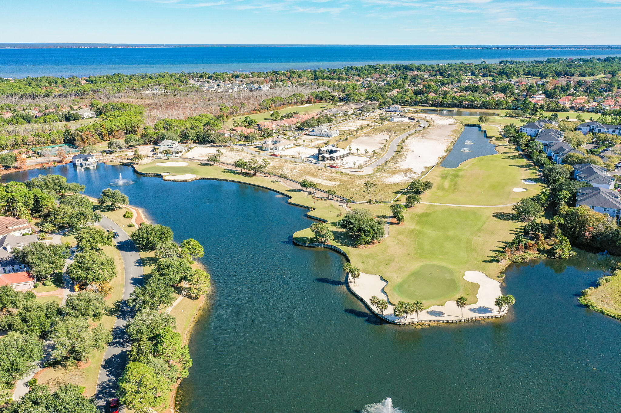 Build your dream home (on lot 1) in one of Destin's most desirable gated golf communities, Regatta Bay! The homesite is in Regatta's newest development, Tradewinds. Tradewinds will consist of 54 homes & will have a West Indies style of architecture w/ Dutch influence. Owner has the opportunity to choose an approved Architect & an approved Builder. Regatta Bay is a quiet, gated, golf & boating community that offers a LIFESTYLE unlike no other! The Regatta Bay Lifestyle is all about convenience! You can use your golf cart to get to so many fun places in minutes, including the Beach! See aerial photos! Within Regatta Bay, there is golf, swimming, tennis, pickle ball, park, playground, Regatta Bay Clubhouse, Legendary Marine & Legendary Yacht Club. Regatta Bay offers a private road that takes residents to the Destin Commons, where you'll find an array of popular men's and women's retail stores, a variety of restaurants, Whole Foods, Bass Pro, Lowes, AMC movie theater and Uncle Buck's Bowling! ALL ACCESSIBLE BY GOLF CART.