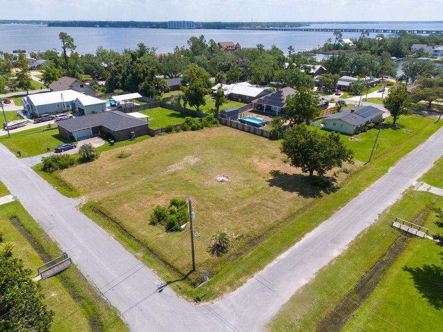 Discover the perfect spot to build your dream home on this beautiful .26-acre residential lot located at 113 Carolina Avenue in the heart of Lynn Haven. This prime piece of property offers an unbeatable combination of natural beauty and convenient access to all the amenities and attractions this charming city has to offer.Ideal Location: Nestled just one block from the Bay, this lot provides the tranquility of waterfront living while being within easy reach of major city parks. Enjoy the serene environment and picturesque views that come with proximity to the water.Outdoor Enthusiast's Dream: A large oak tree graces the property, adding to its charm and providing a shady retreat. The land is situated near numerous city parks, including the popular Kinsaul Park, perfect for family outings, picnics, and recreational activities. Additionally, a boat launch is conveniently close by, making it easy to enjoy boating and fishing trips.Convenient Transportation: Positioned near Highway 77 and 390, this lot offers seamless travel throughout Lynn Haven and beyond. Quick access to these major routes means you're never far from shopping, dining, schools, and other essential services.Community and Lifestyle: Enjoy the best of both worlds with a peaceful residential setting that's just minutes away from the vibrant community activities and amenities Lynn Haven is known for. The nearby city park, just one block away, offers a great place for kids to play and for adults to unwind.Don't miss out on this exceptional opportunity to own a piece of prime real estate in one of Lynn Haven's most desirable areas. With its combination of natural beauty, convenient location, and ready-to-build status, 113 Carolina Avenue is the ideal spot to create a home that perfectly suits your lifestyle.