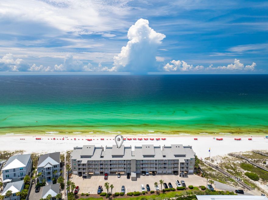 Gulf-front elegance meets exclusive privacy in this rare, low-density, gated enclave of just 24 units. Perched 19 feet above the shoreline, this residence offers sweeping, unobstructed views of 400 feet of private white-sand beach and emerald Gulf waters. Enjoy seamless indoor-outdoor living with an oversized 8x28 balcony featuring direct access to the sand and gulf. Recently renovated kitchen and spa-like primary bath elevate the experience. Thoughtfully designed with a King primary suite, Queen guest room, and an additional guest suite with two Queen beds.