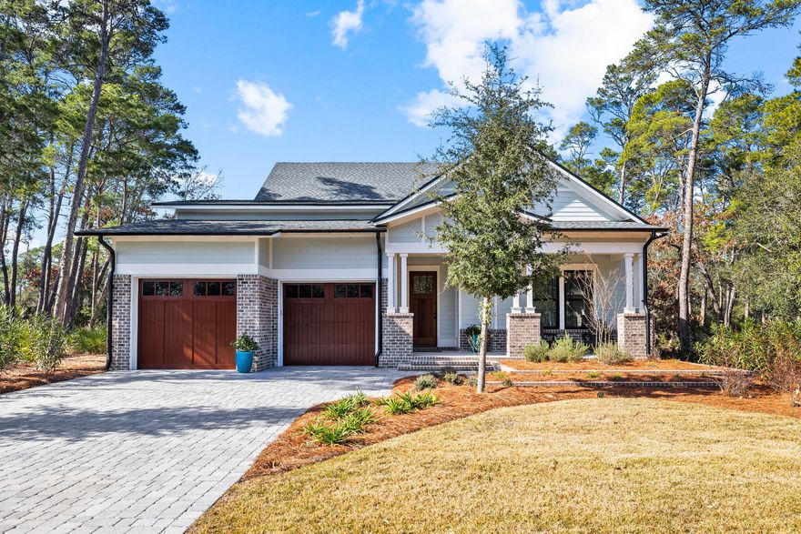 Exquisite custom home on Sharks Tooth's 16th fairway in the coastal sanctuary community of Wild Heron. Discover luxury living that is sophisticated and comfortable. Spacious living areas, gourmet kitchen with Thermador appliances, wet bar, ice maker and beverage fridge. Hardwood flooring throughout, tasteful shiplap accents and detailed finishes. Heated pool with sun deck and full pool bath. Perfectly landscaped. State of the art community amenities include pools, fitness studio, walking trails, fire pit and pavilion.