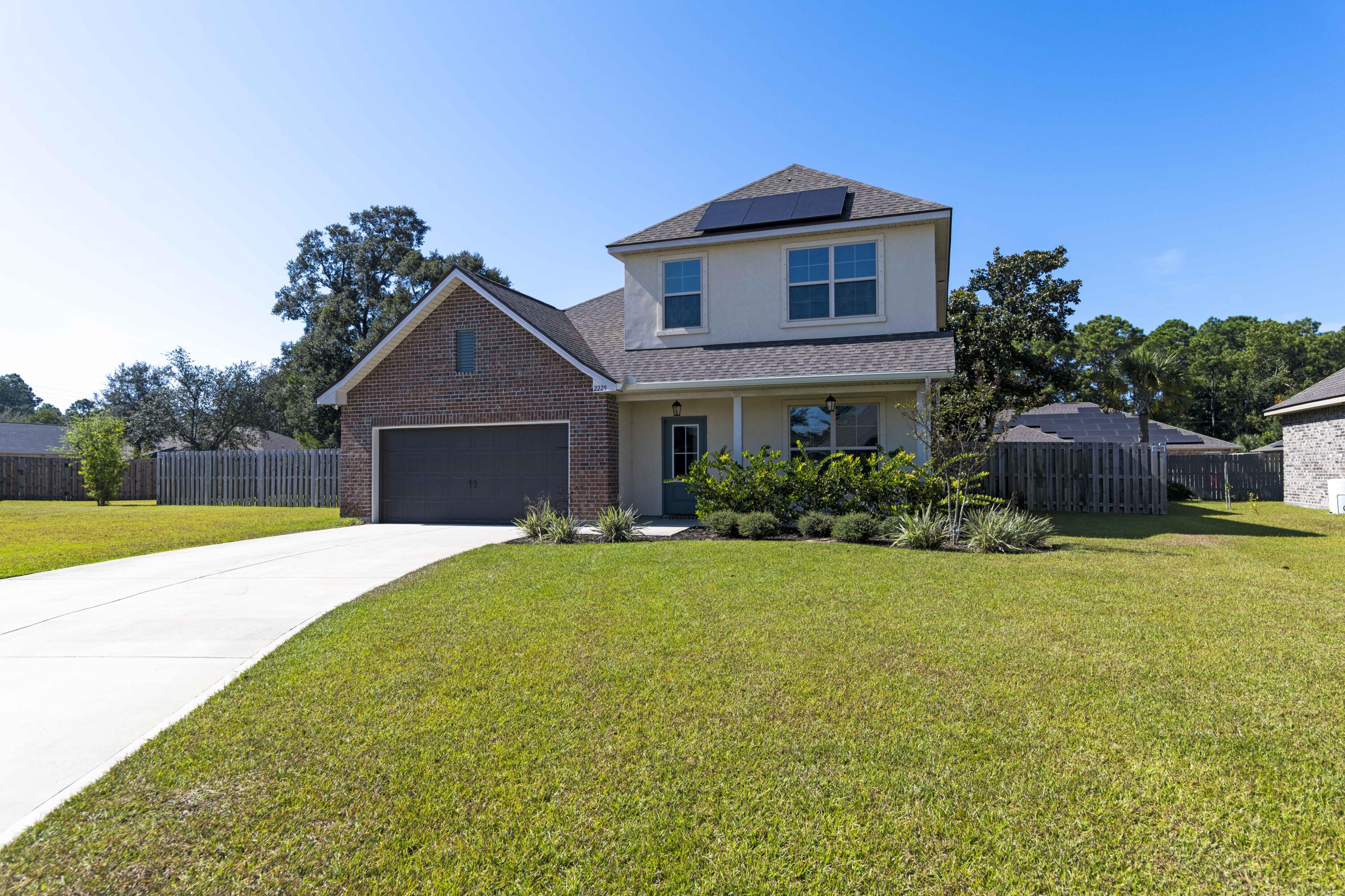 Lovely family home in Gulf Breeze! This 2-story home gives you 4 bedrooms, 2.5 bathrooms, and a roomy 1921 sq ft of living space. The first floor offers a fantastic open floor plan, separate dining room and tile flooring. The kitchen is equipped with all stainless-steel appliances, granite counter tops, and access to the spacious backyard from the exterior door. This beautiful home also boasts a large primary suite with a walk-in closet for easy access to all your clothes. You'll also love the landscaped yard, oversized 2-car garage, and solar panels that come with the house! Located near a public boat ramp and minutes away from both Pensacola and Navarre Beaches. This home sits on a quiet cul-de-sac in the highly coveted Santa Rosa School District.