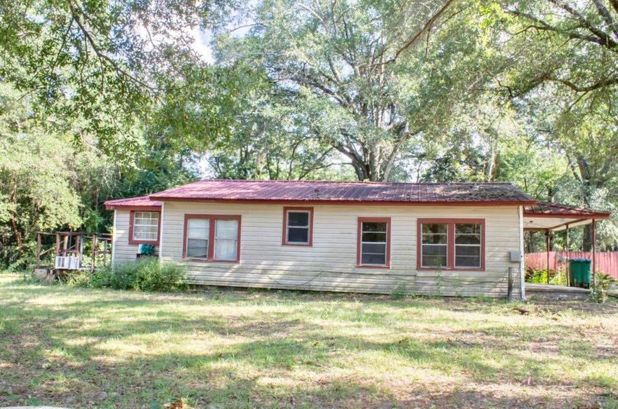 Great piece of land located in south Crestview. This home is for someone who would like to have a Reno project, or to rebuild on this large corner lot. Take a look and imagine the possibilities. This home is centrally located for easy access in and out of town. The home right behind (645 E Walnut) Can be purchased for one sale, TWO HOMES for $70,000. Both lots equal .56 acres. Call For more information.