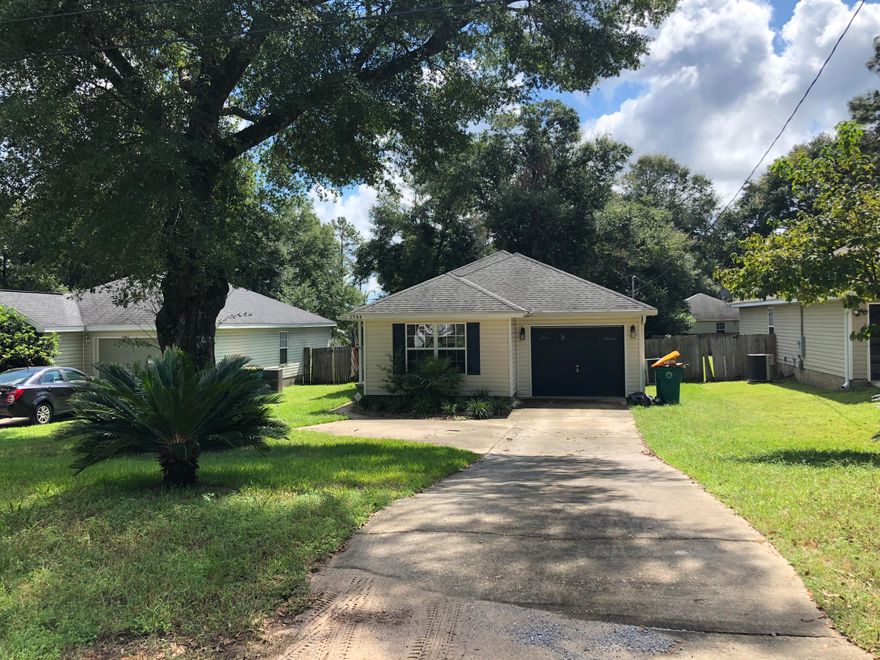 Adorable home ready to be yours! Conveniently located 3 bedroom / 2 bath home with a great spacious lay out. The open concept design features a large eat in kitchen with breakfast bar over looking the living room. Great for entertaining. The living room boasts a built in tv area and built in desk. The master bedroom is tucked back for privacy and has double windows for lots of natural light. A full bath completes your master suite. The additional bedrooms are spacious and have another full bath between. The covered porch area that over looks the privacy fenced back yard. All this with low County Taxes!!!