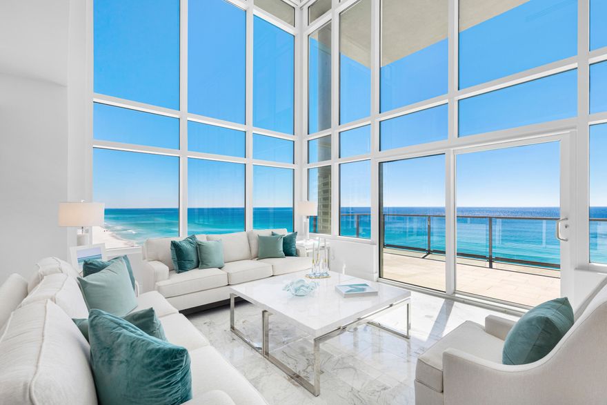 Experience modern coastal luxury in this one-of-a-kind 4-bedroom, 4.5-bath multi-level penthouse spanning just under 5,000 sq ft of unparalleled opulence, where timeless elegance meets cutting-edge technology. Step inside and be captivated by soaring 18 ft ceilings and expansive walls of glass showcasing breathtaking Gulf views from the 10th floor. Every inch of this extraordinary residence has been meticulously redesigned, from the custom-crafted kitchen with enhanced butler's pantry to the spa-like primary suite. Polished marble flooring extends throughout the home and ascends the floor-to-ceiling marble walls in the primary and half baths. The open concept living and dining areas flow seamlessly to an extensive 344 sq ft balcony where you can relax to the tranquil sound of the waves.