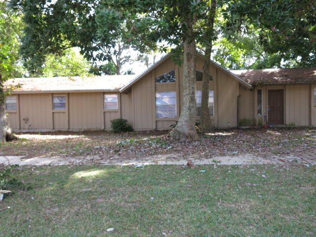 Large corner lot in the heart of Fort Walton Beach, convenient to all schools and Both Hurlburt Field and Eglin Air Force Bases.Large great room features a stone fireplace and high beamed ceilings. Recently painted inside and out. Newer carpet inside.Privacy fenced back yard large enough for a pool.Call today for an appointment to view this home.